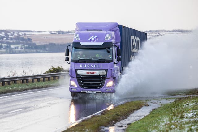 Vehicles drive on the A9 in Inverness, as snow, rain and wind warnings are in force (Paul Campbell/PA)