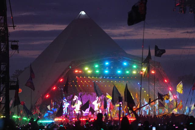 <p>The crowd watching Coldplay performing on the Pyramid Stage at Glastonbury Festival (Yui Mok/PA)</p>