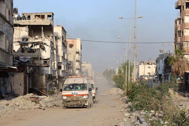 <p>Ambulances transport wounded Palestinians from the Kamal Adwan Hospital to the Al-Shifa hospital in Gaza City</p>
