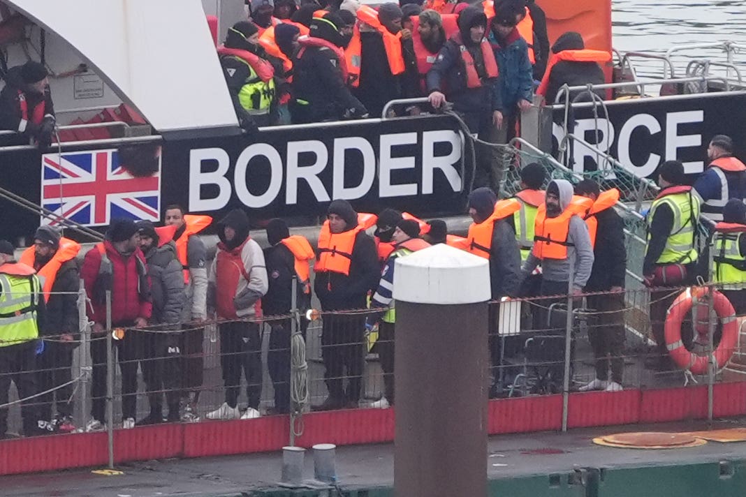 The last group of migrants to cross the English Channel in 2024 are brought into Dover