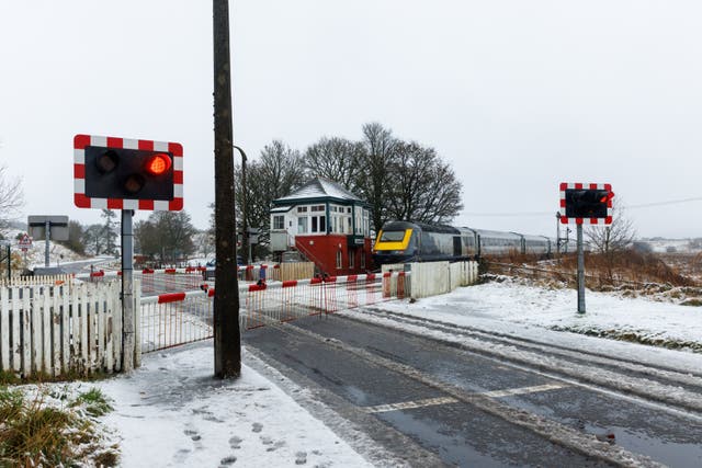 The railway crossing at Blackford, Perthshire covered in snow (Robert Perry/PA)