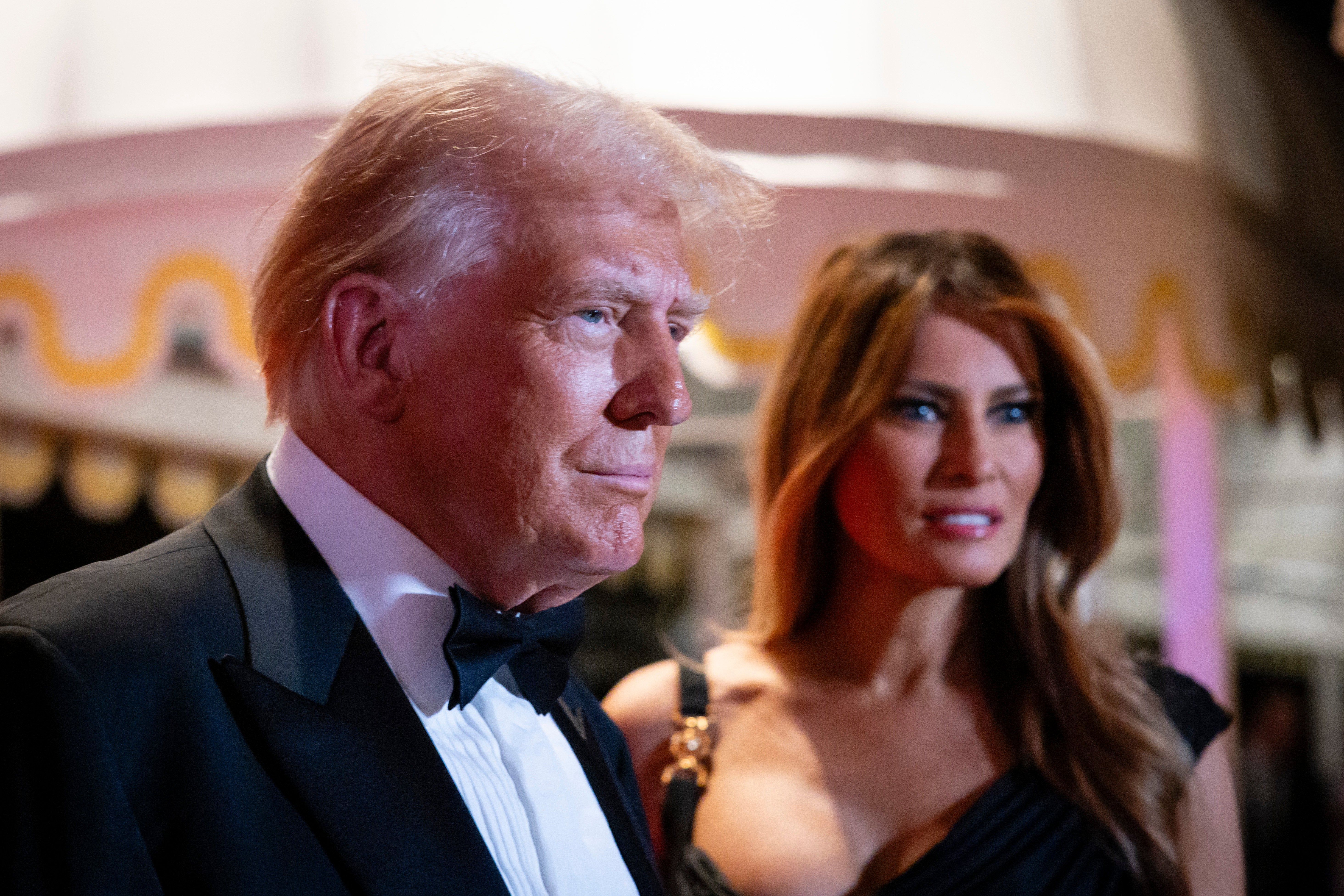 Melania Trump with her husband on New Year’s Eve. She has tended to avoid the limelight