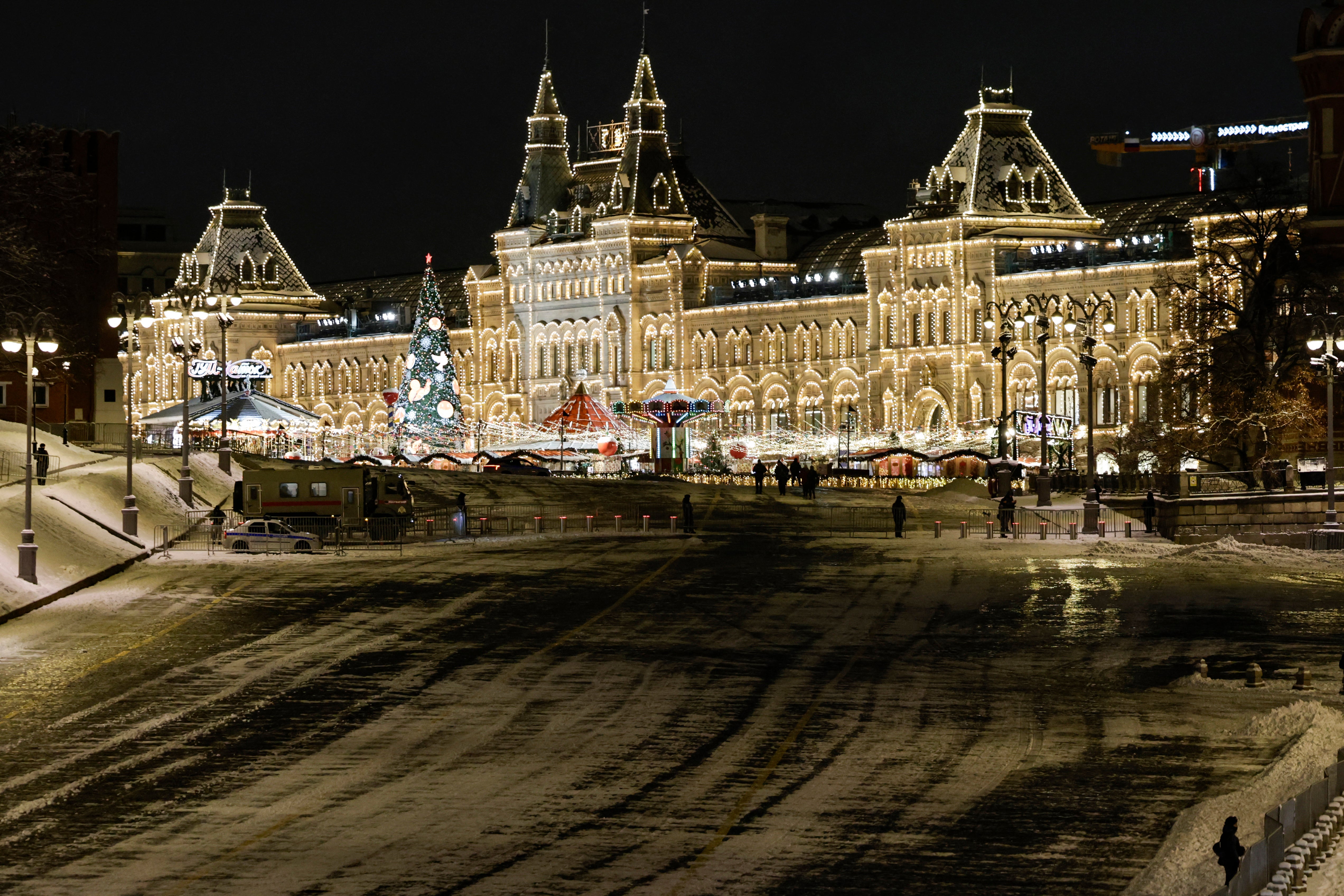 Law enforcement officers guard the closed Red Square during the New Year’s Eve celebrations in Moscow