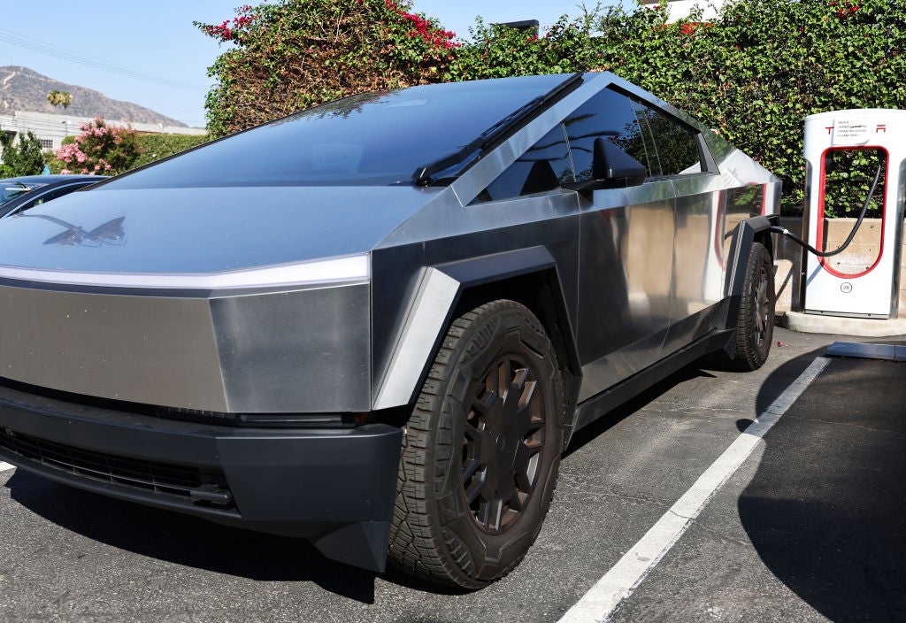 A Tesla Cybertruck recharges at a Tesla dealership on 24 July, 2024 in Burbank, California