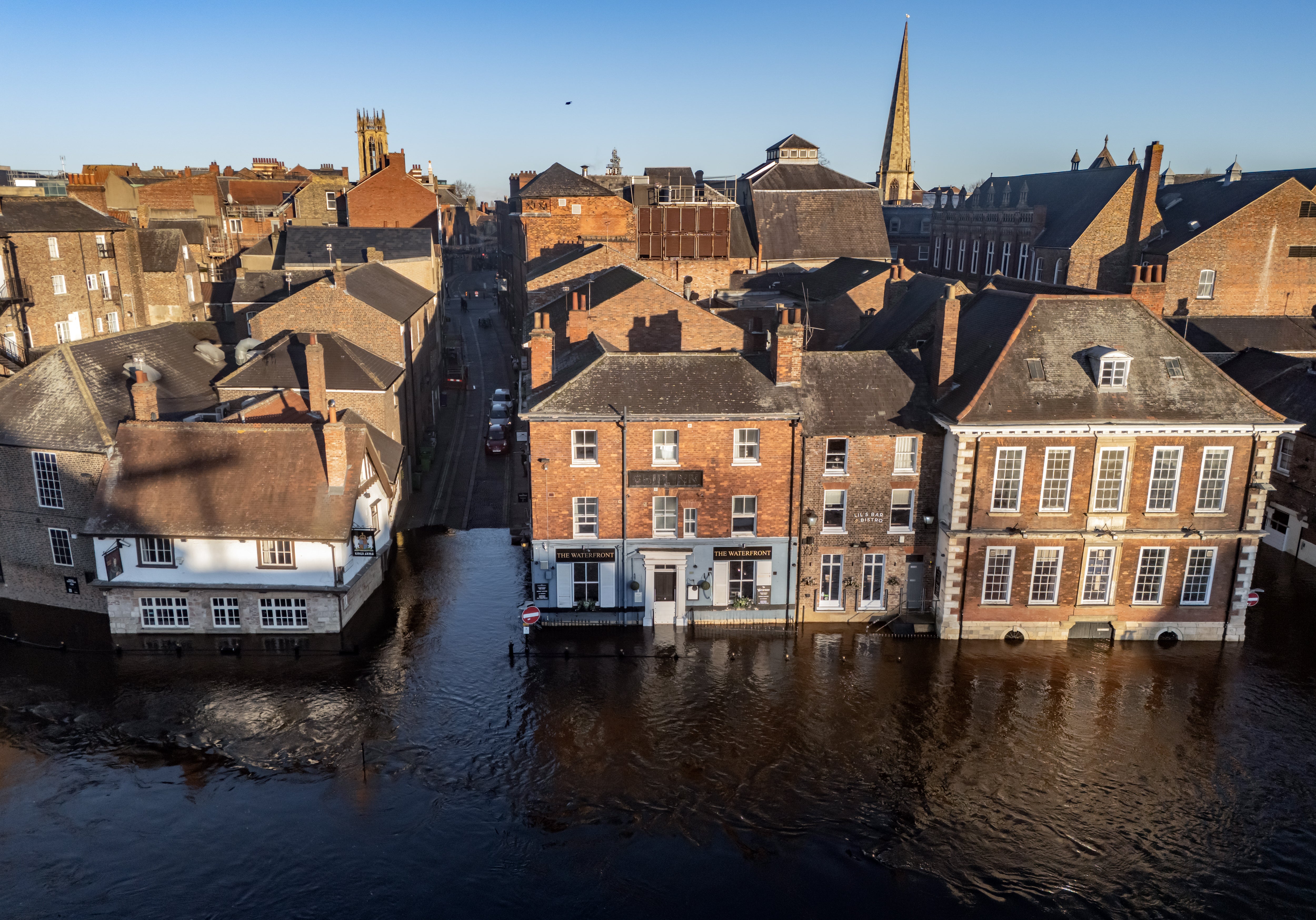 Flood water in York after the River Ouse burst its banks. A three-day yellow warning for snow has been issued for almost all of England and Wales and parts of Scotland this weekend