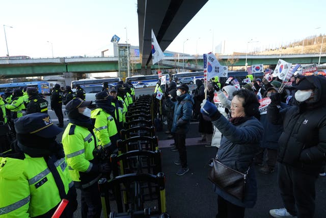 <p>Supporters of impeached South Korean president Yoon Suk Yeol stage a rally near the presidential residence in Seoul on 3 January 2025</p>