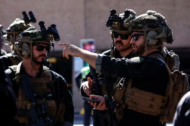 <p>Local SWAT teams patrol outside the Caesars Superdome in New Orleans ahead of the Sugar Bowl NCAA College Football Playoff game Thursday.</p>