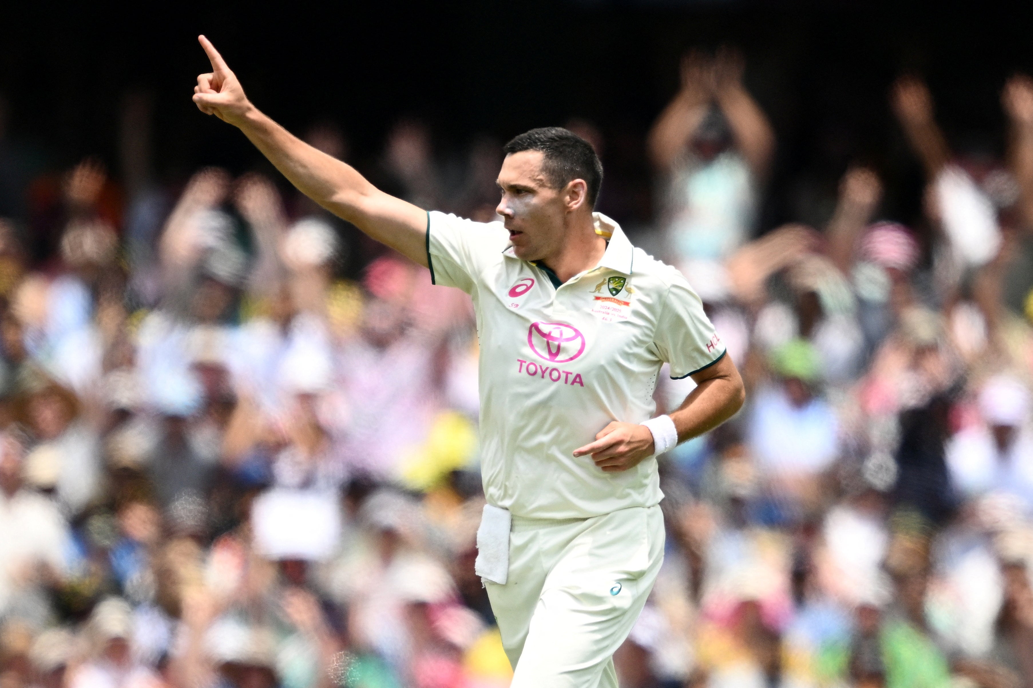 Australia's Scott Boland celebrates taking the wicket of India's Virat Kohli