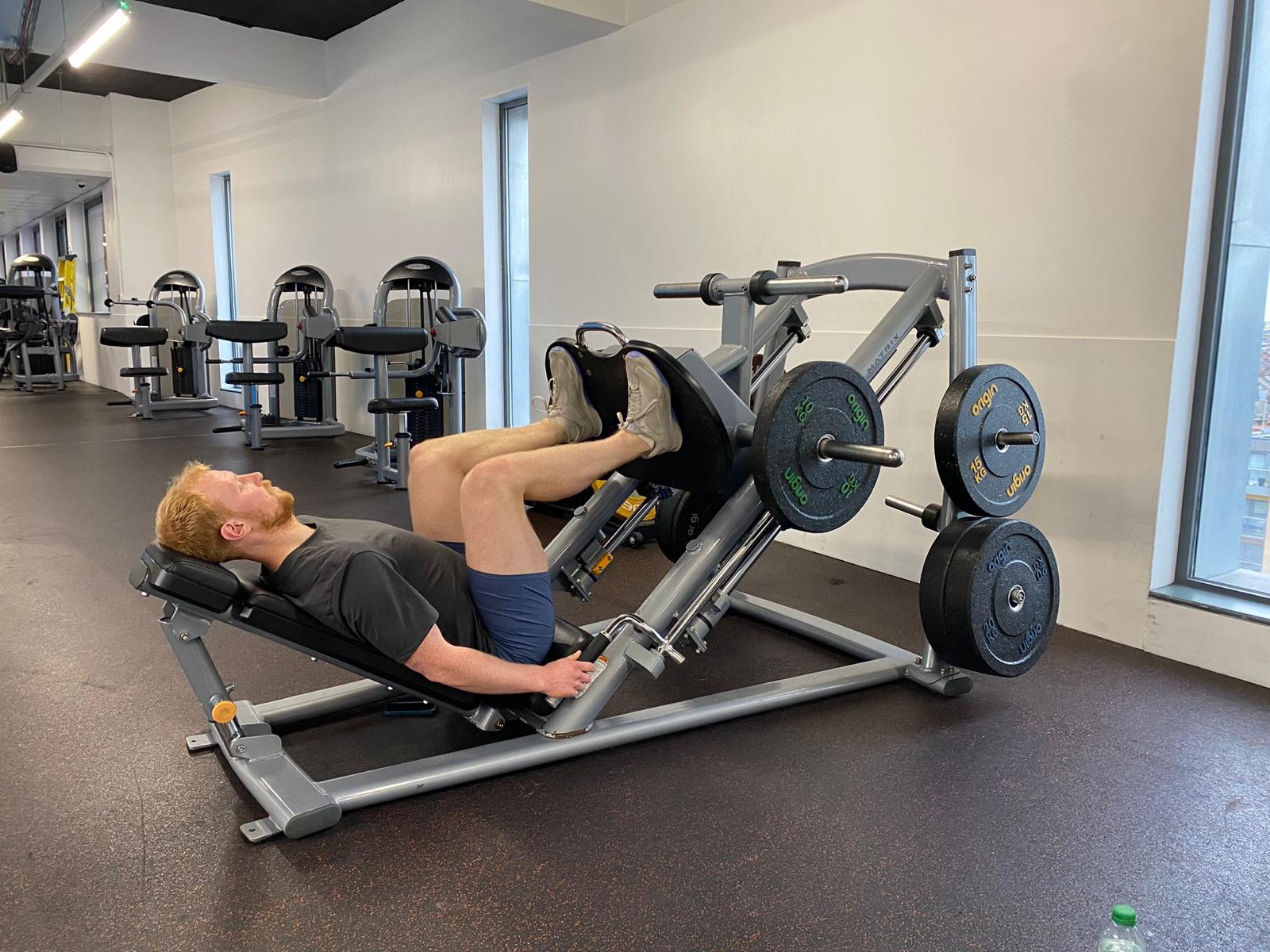 Using the leg press machine at The Gym Group, Wood Green The Mall