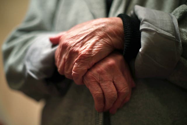 Undated file photo of the hands of an elderly woman. The Government has announced a new commission for reforming social care in England. PA.