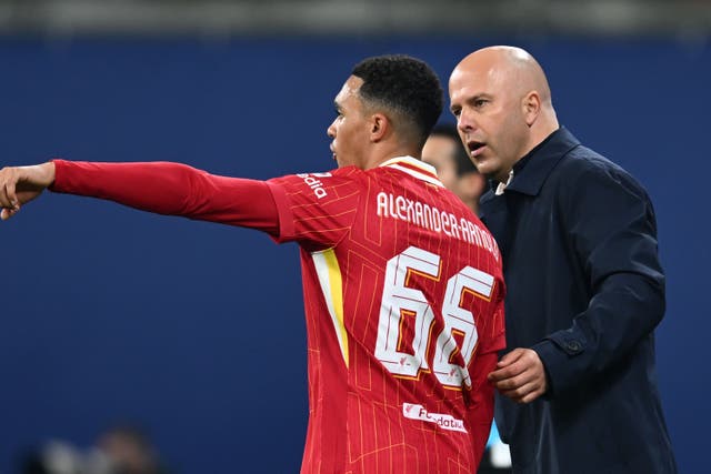 <p>Liverpool’s Trent Alexander-Arnold and manager Arne Slot in Leipzig, Germany</p>