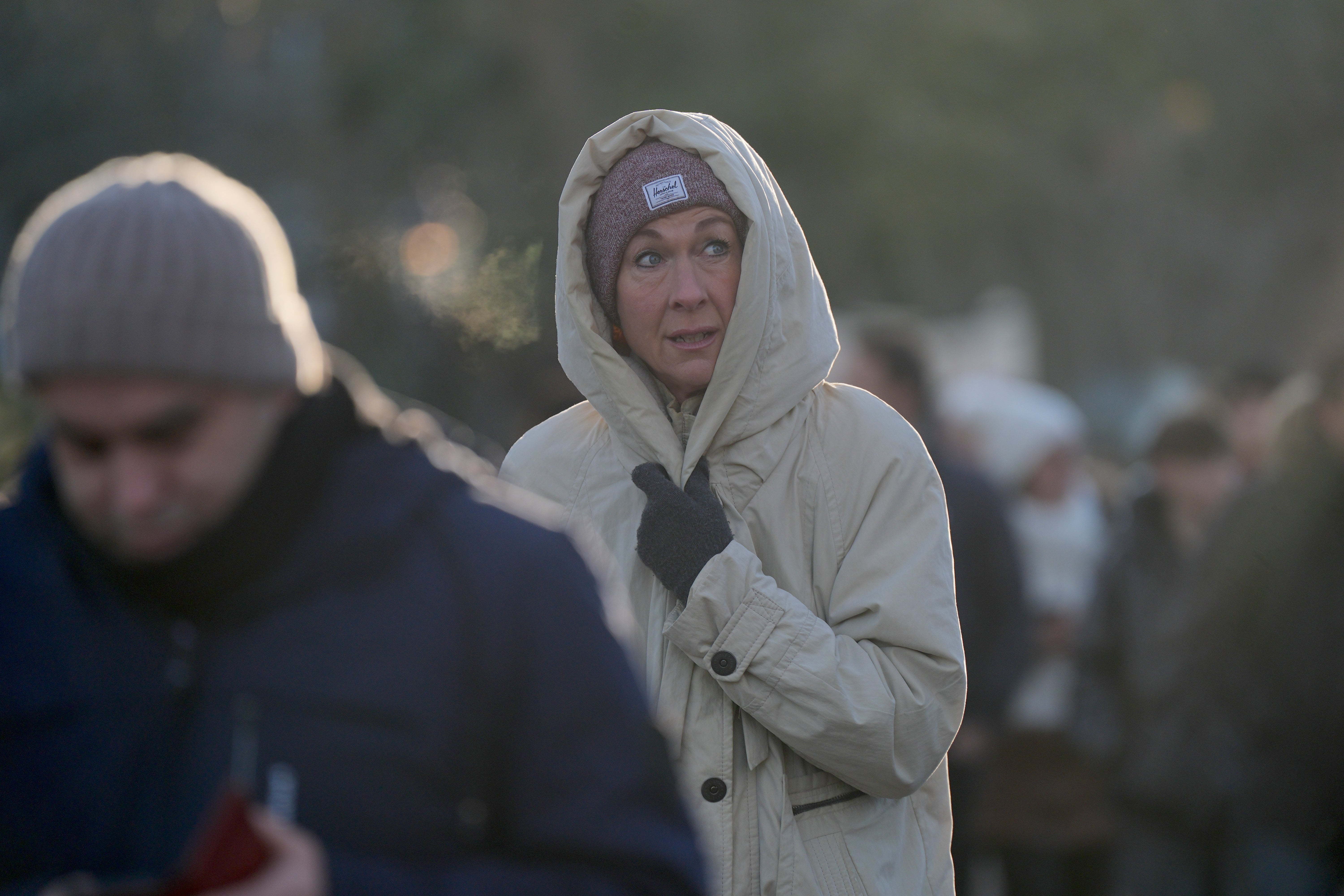 A woman braves the cold walking through St James's Park in Central London