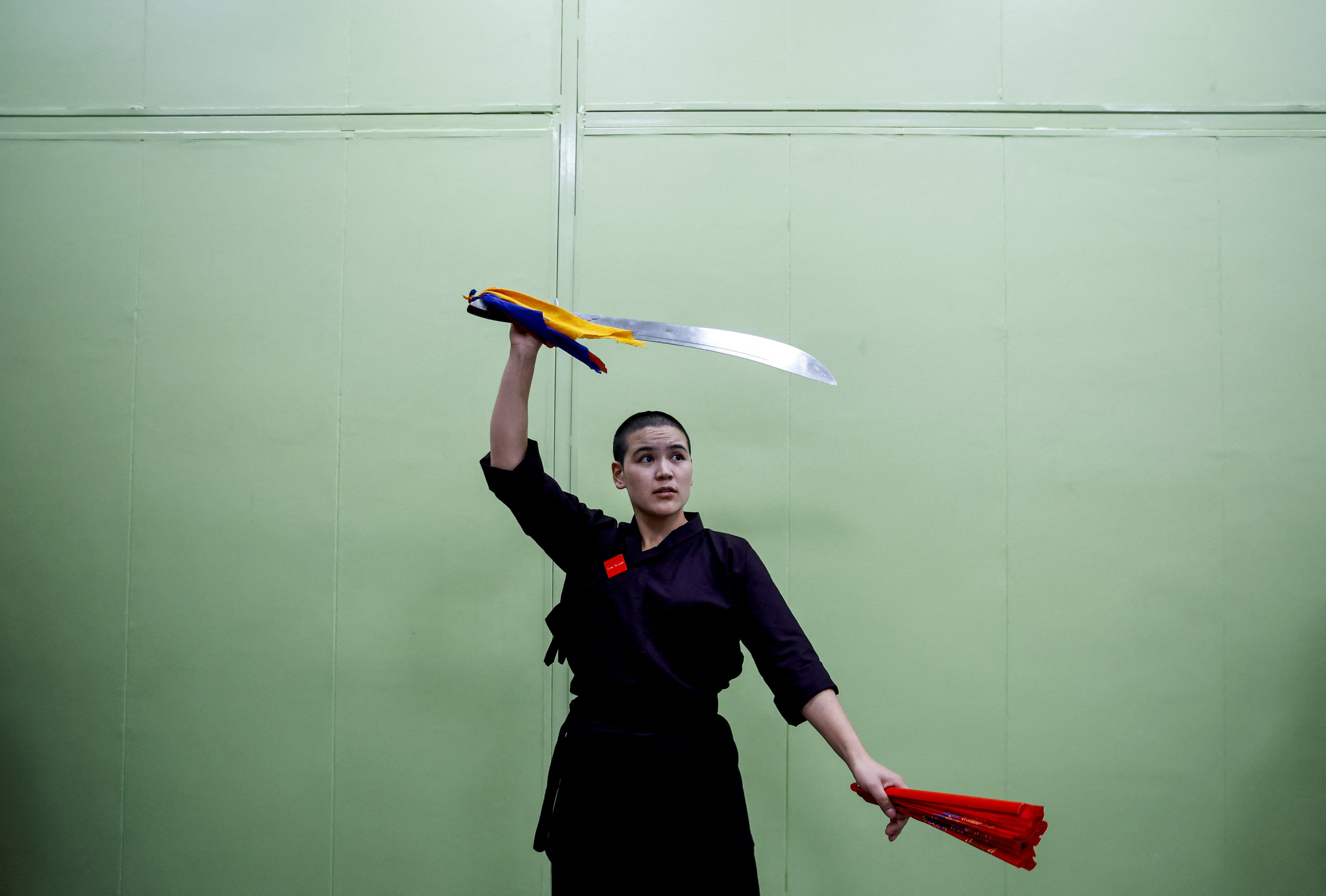 A Kung Fu nun practises as she waits for her performance during the reopening of the nunnery for the first time since the COVID-19 closure at Druk Amitabha Mountain Nunnery in Kathmandu, Nepal