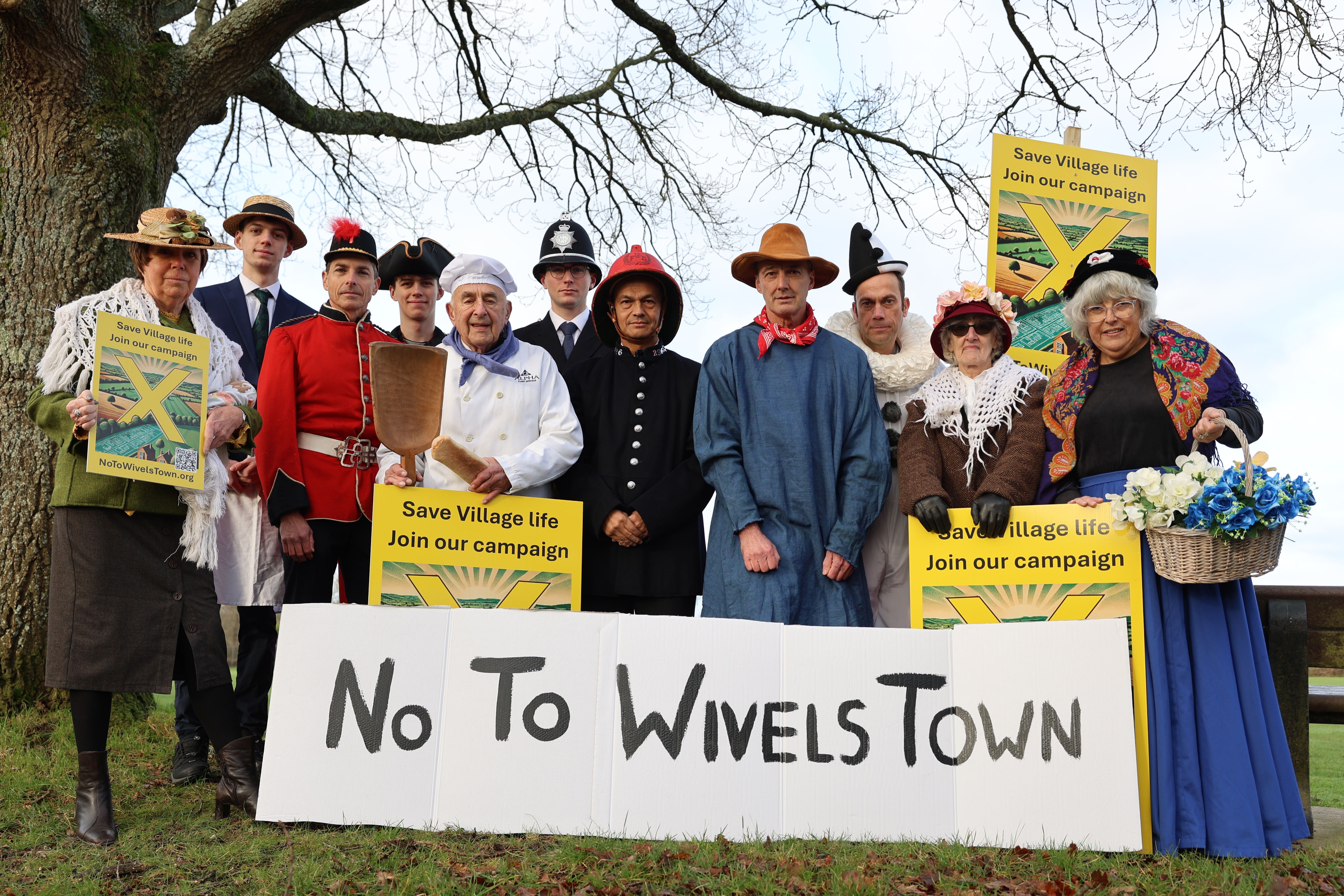 Members of the No To WivelsTown campaign protesting against development in the village believed to have inspired the children’s TV show Camberwick Green (No To WivelsTown/PA)