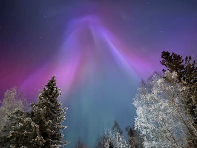 <p>The northern lights appear over Anchorage, Alaska, on Wednesday. The Space Weather Prediction Center says a minor geomagnetic storm is likely to impact Earth over the weekend, bringing the potential for more dazzling skies </p>