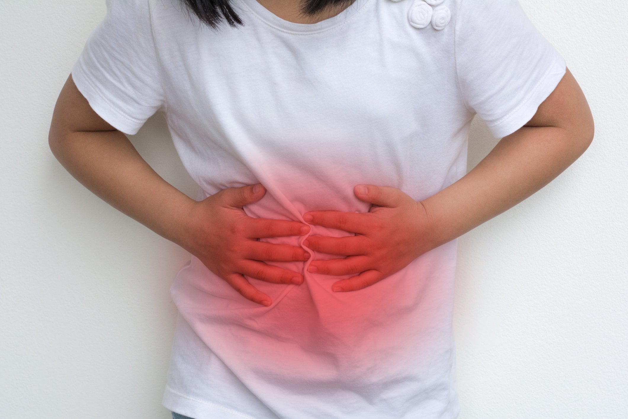 A child holds her hands up to press on her stomach. More children around the US are getting kidney stones, which can cause sharp pain in the lower abdomen. The increase is especially notable in adolescent girls