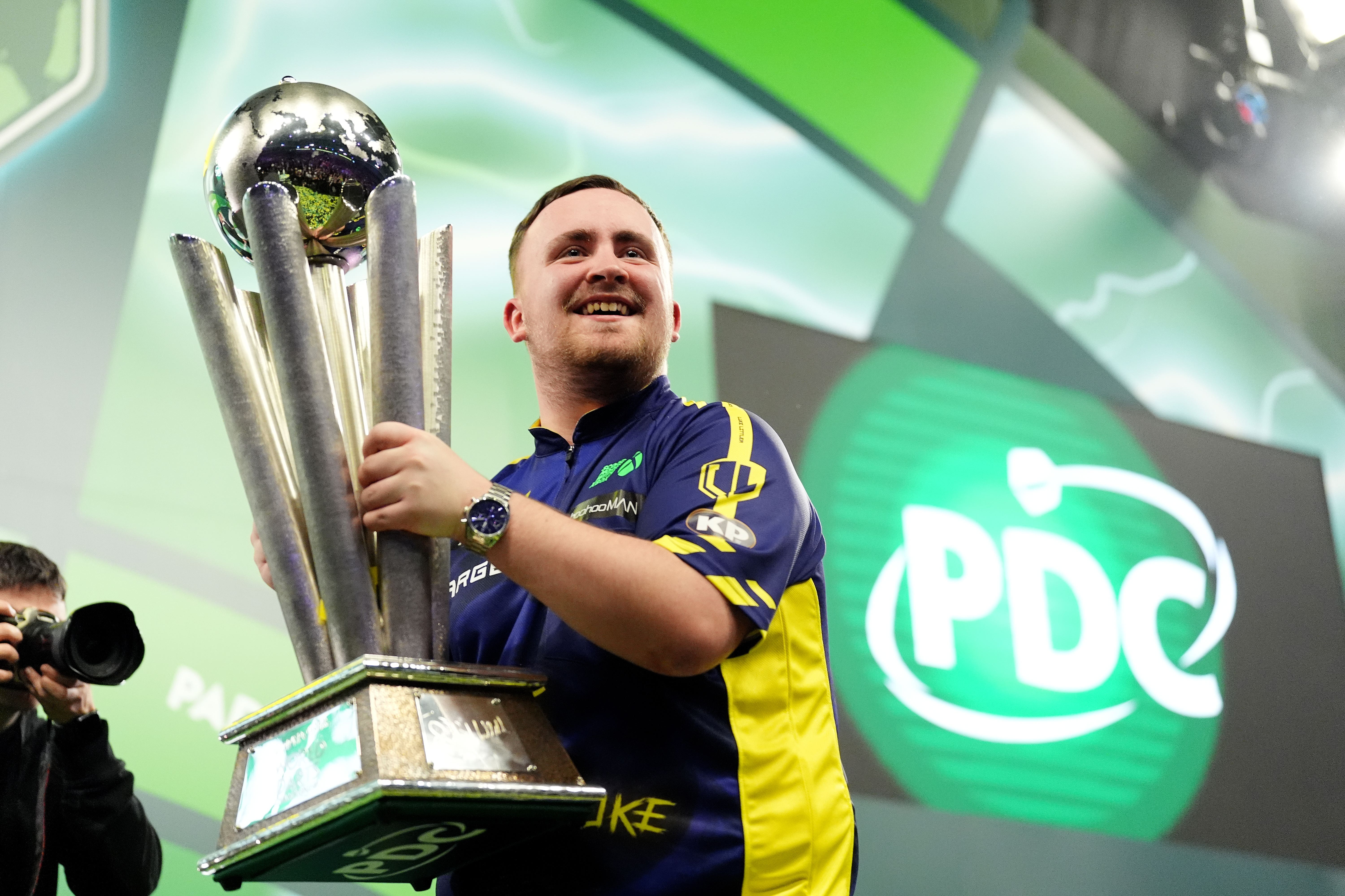 Luke Littler lifted the Sid Waddell Trophy after beating Michael van Gerwen 7-3 at Alexandra Palace (Zac Goodwin/PA)