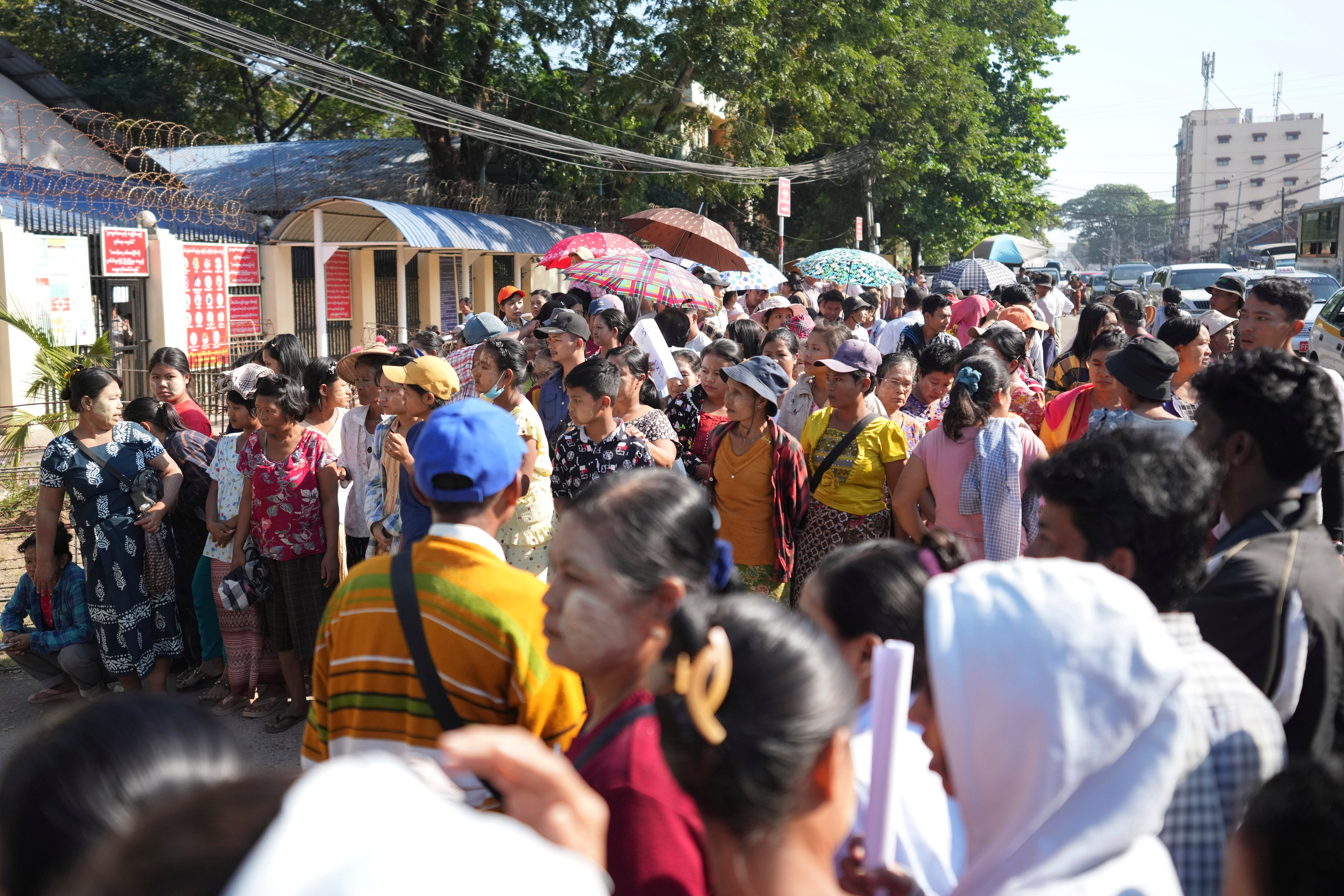 Family members wait to welcome released prisoners from Insein Prison Saturday, 4 Jan 2025, in Yangon, Myanmar, as the military government has released more than 6,000 prisoners and has reduced other inmates’ sentences as part of a mass amnesty to mark the 77th anniversary of independence from Britain