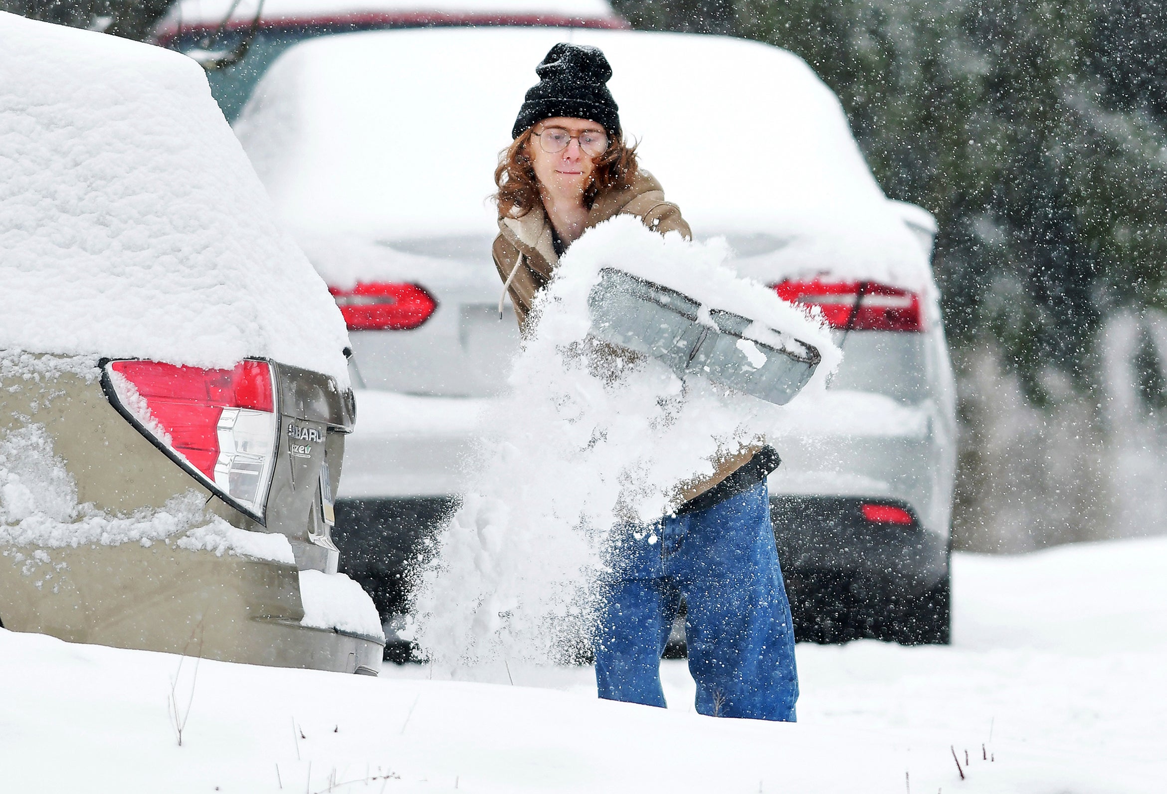 Elijah Minahan, of Johnstown, Pennsylvania, shovels out the driveway at his home. More than 60 million Americans faces threats from a winter storm moving across the U.S.