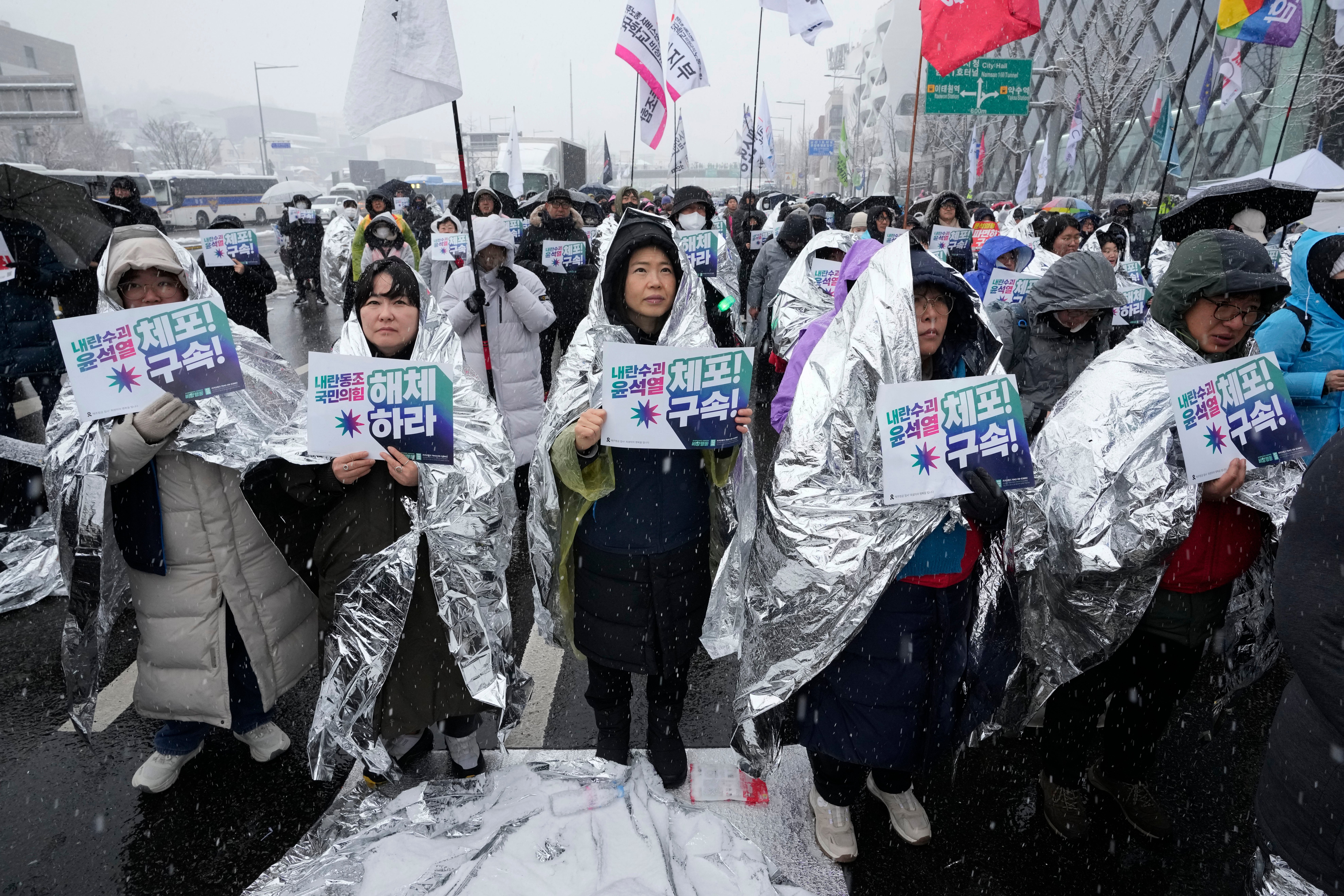 Protesters attend a rally demanding the arrest of impeached South Korean President Yoon Suk Yeol near the presidential residence in Seoul, South Korea, Sunday, 5 Jan 2025