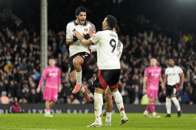 <p>Raul Jimenez (left) snatched Fulham a point from the penalty spot </p>