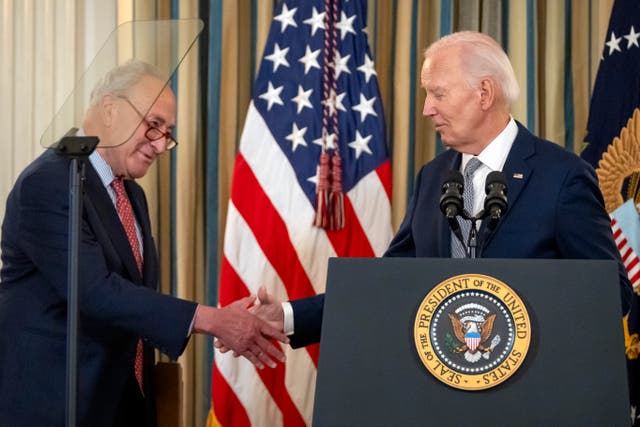 <p>Chuck Schumer shakes hands with Joe Biden during an event at the White House this week. The senator insists his party did not mislead the public </p>