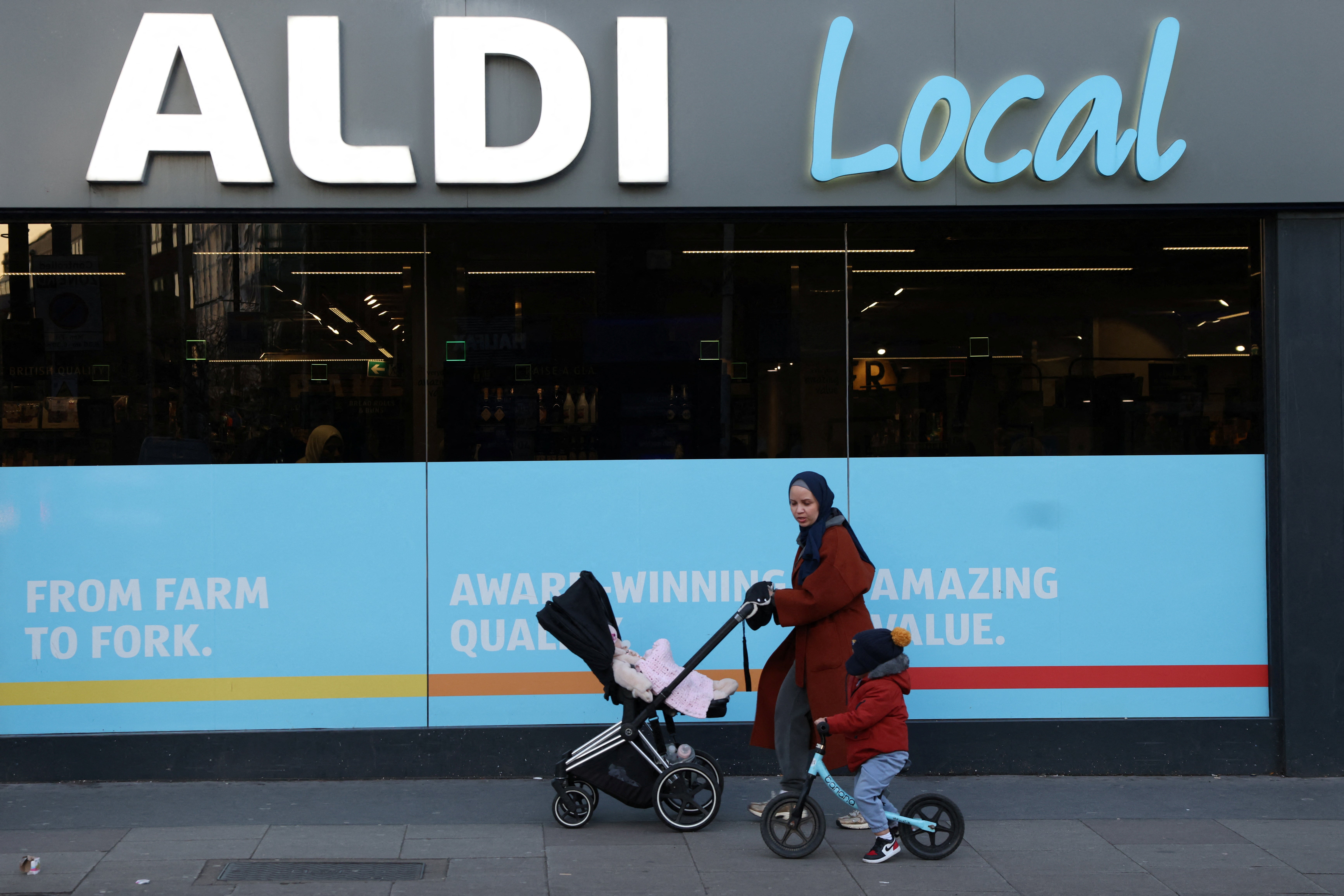 People walk past an Aldi Local store in London, Britain, January 2, 2025