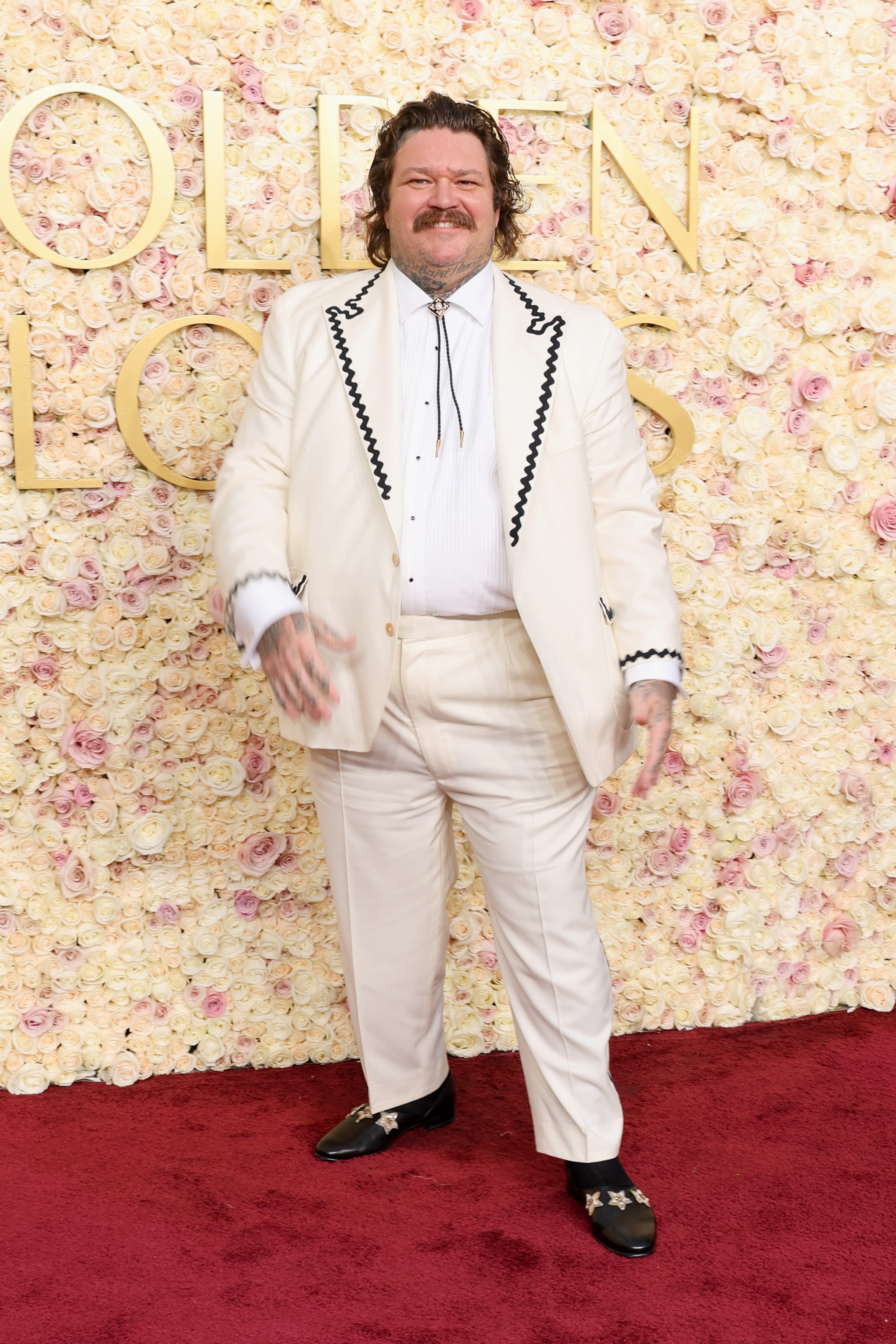 Matty Matheson in a white suit outside the 2025 Golden Globes