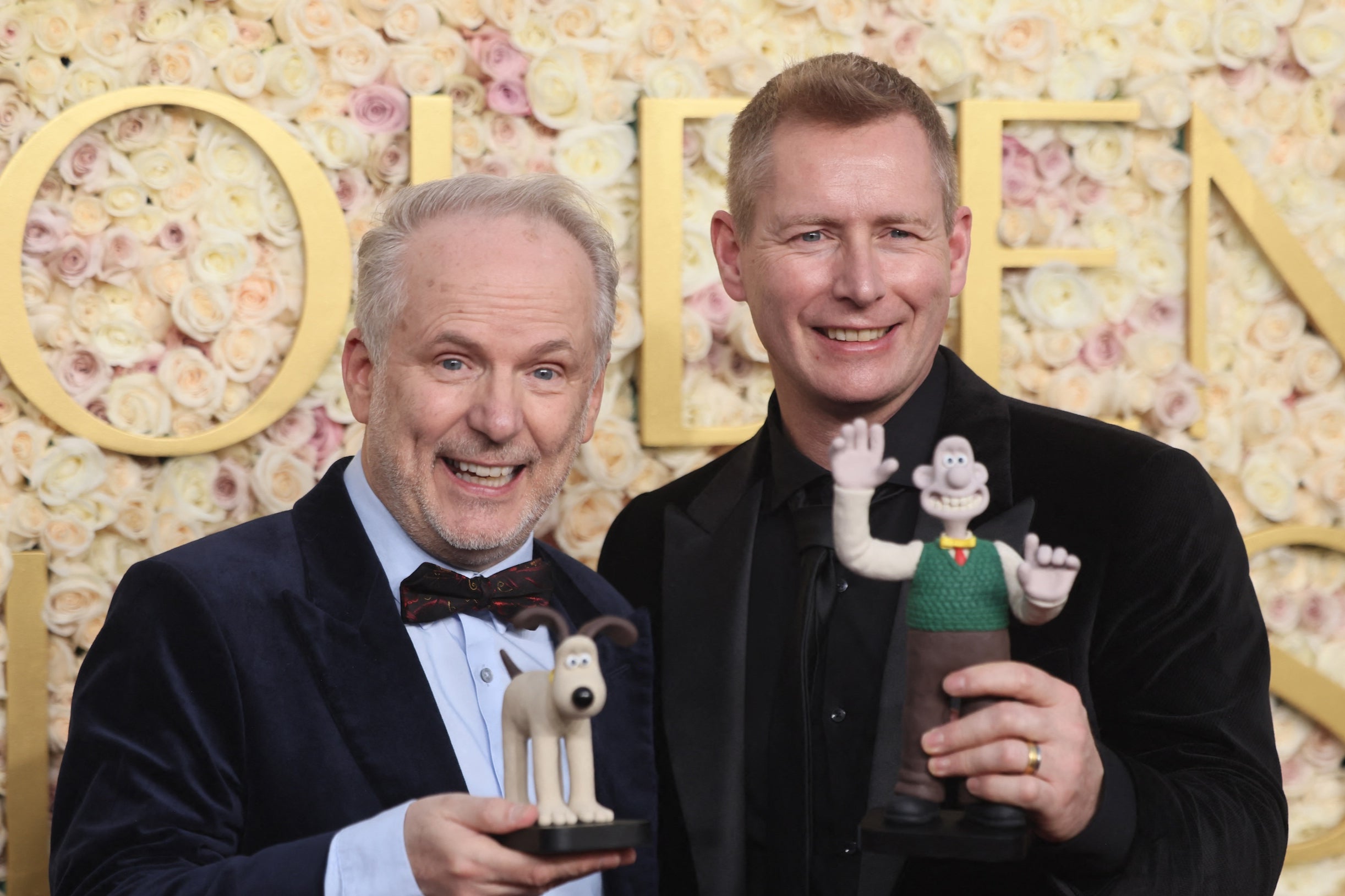 English directors and creators Nick Park (left) and Merlin Crossingham hold the figurines of Wallace and Gromit