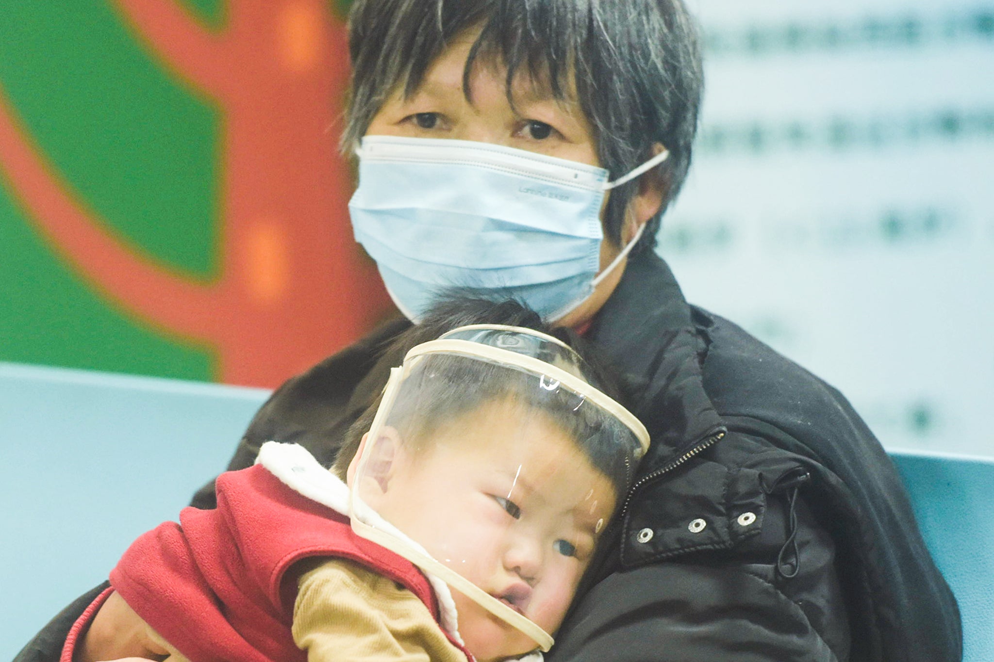 A child, accompanied by their parents, at a hospital in Hangzhou, China