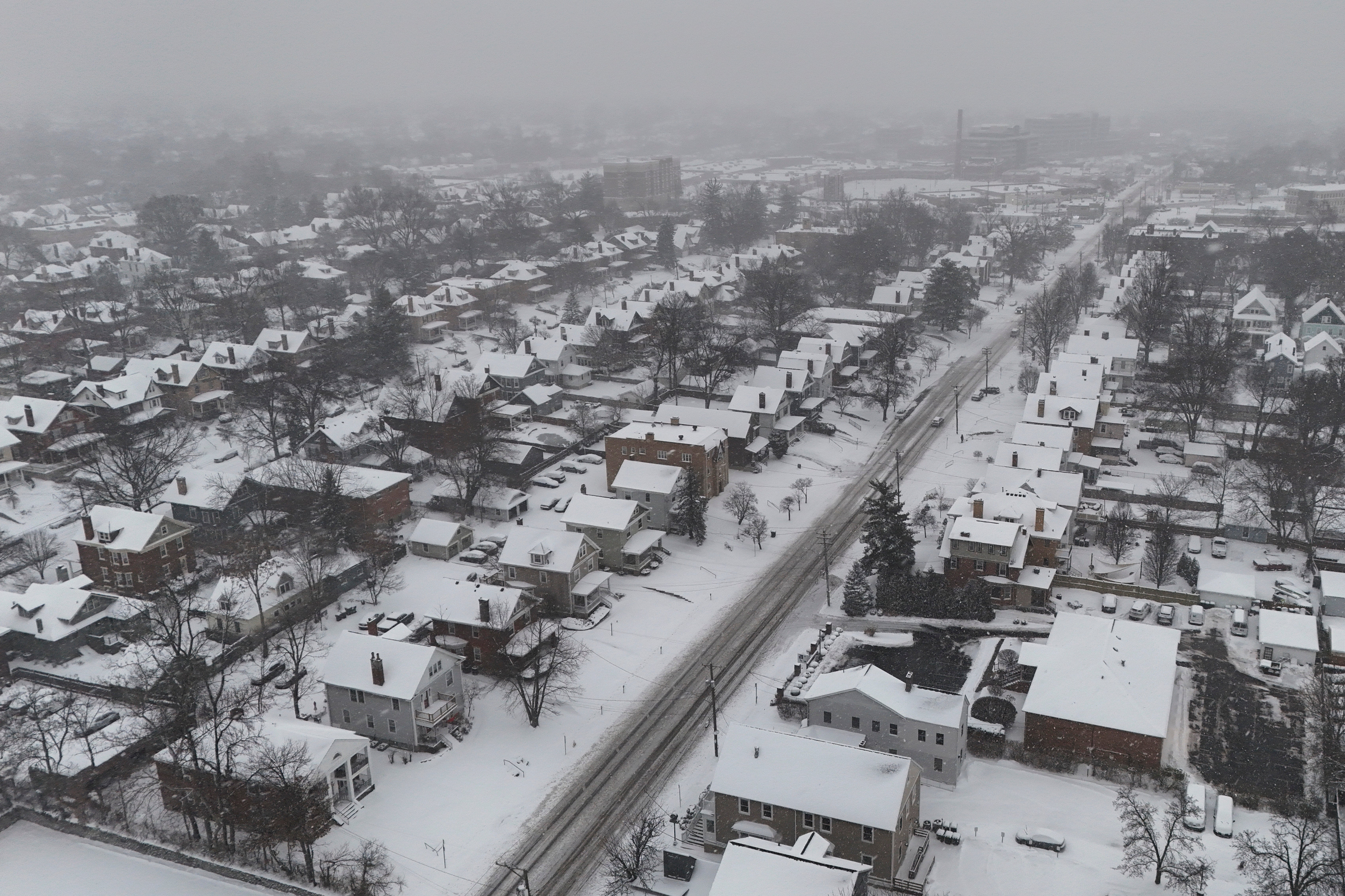 Snow covers homes on Monday during a winter storm in Cincinnati, Ohio. The city saw record snowfall over the weekend