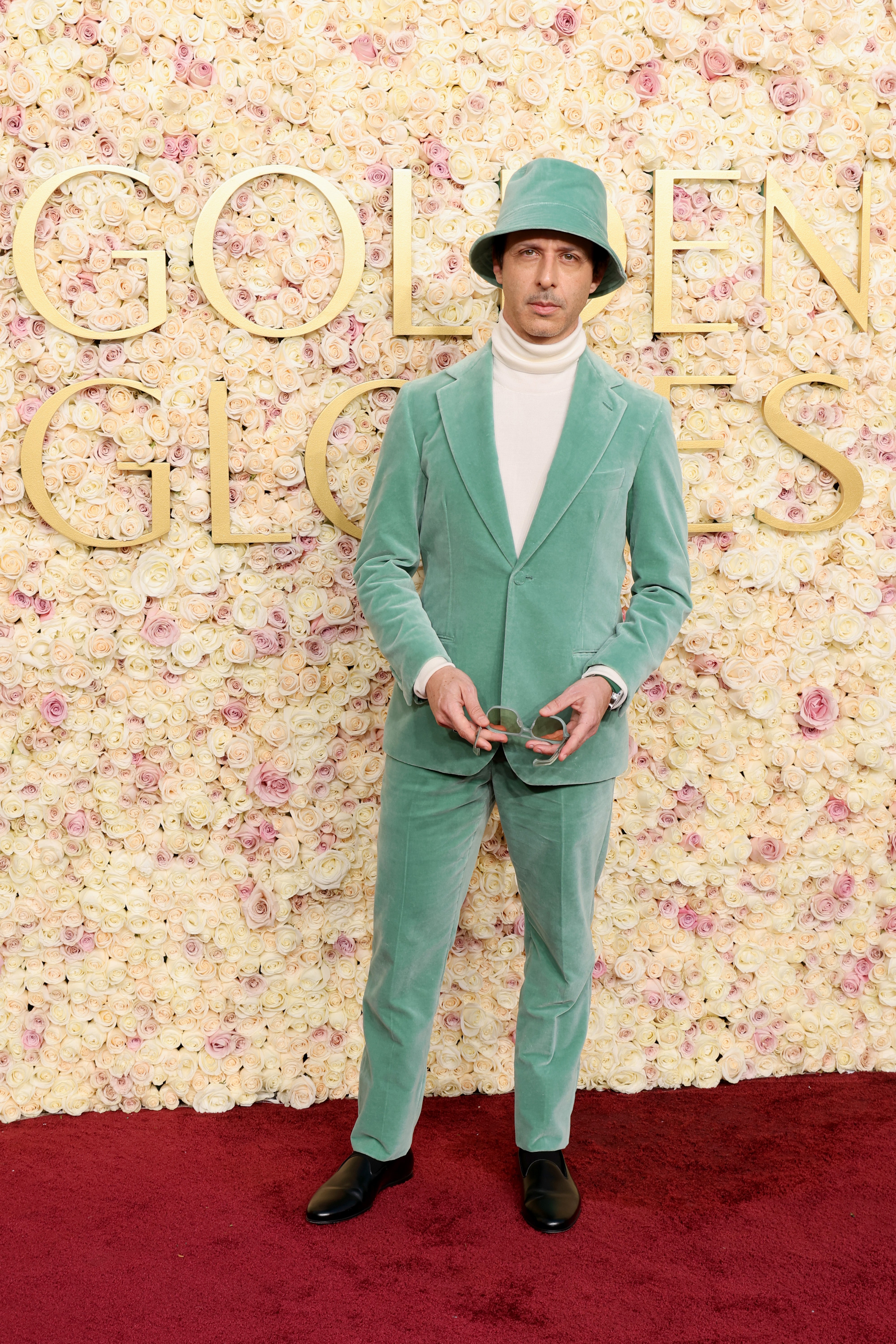 Jeremy Strong received mixed reactions for his mint green suit and bucket hat at the Golden Globes