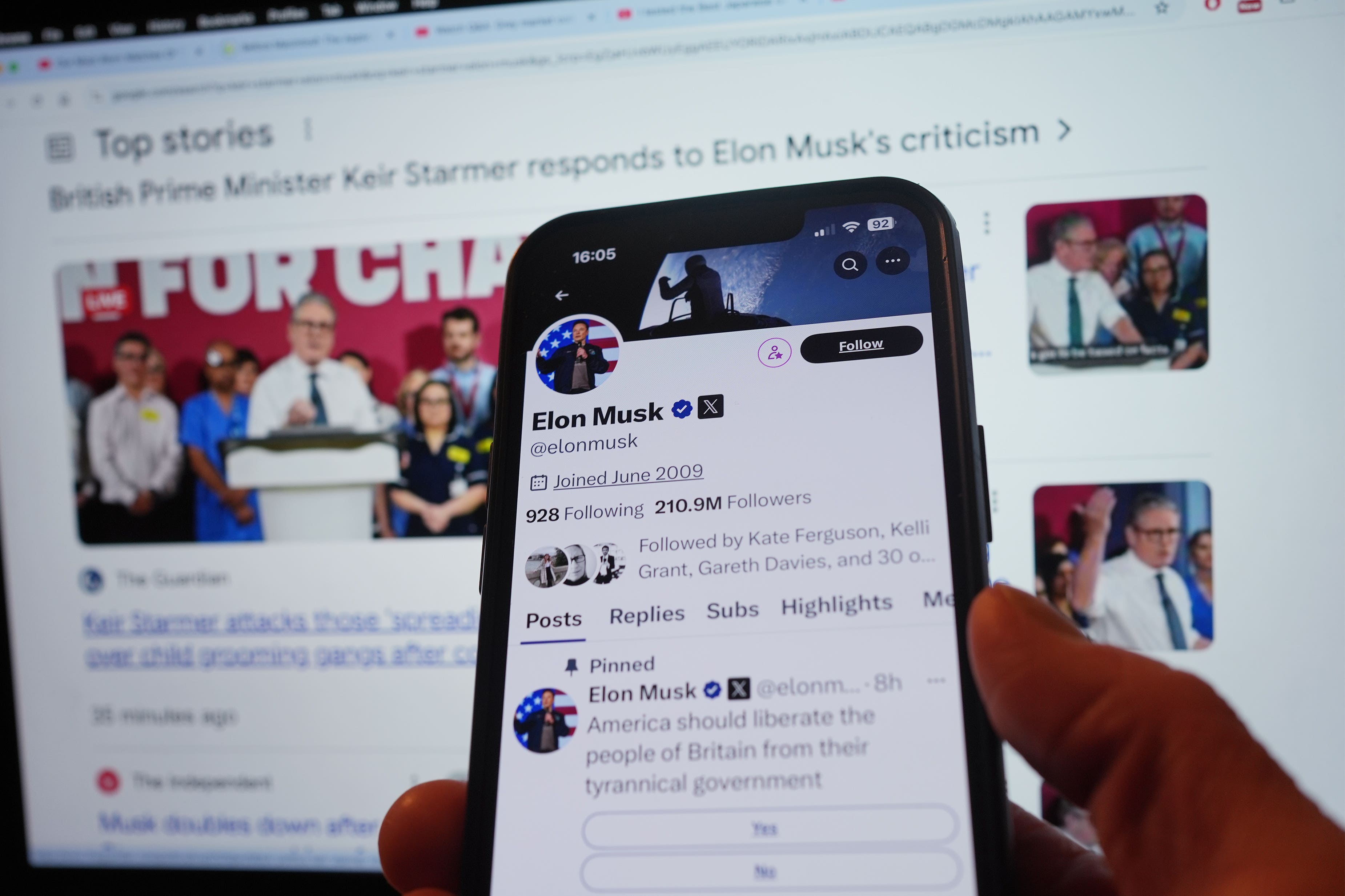 The official account of Elon Musk on social media app X displaying a pinned post, a poll asking if ‘America should liberate the people of Britain from their tyrannical government’, on a mobile phone in London (Yui Mok/PA)