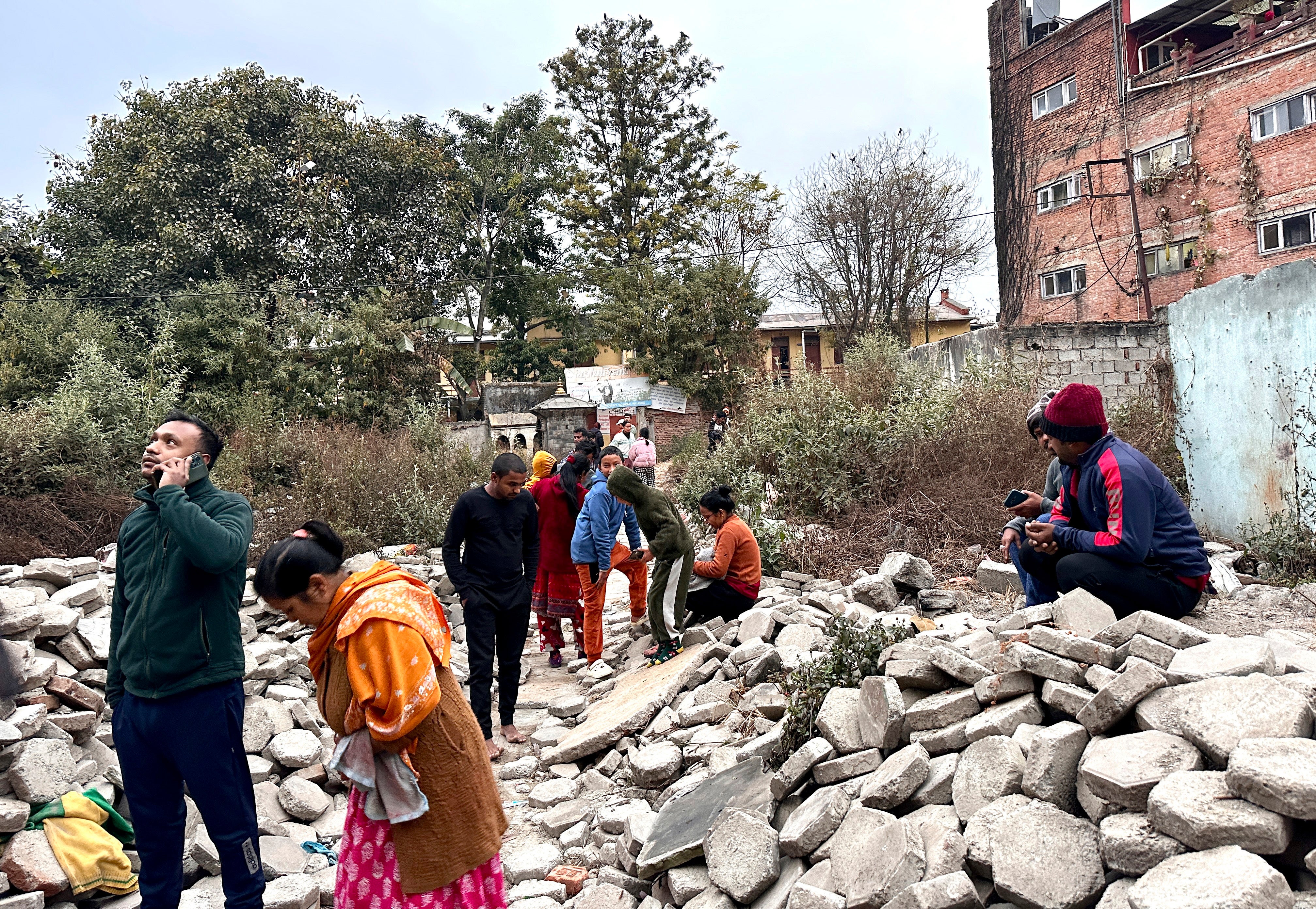 Nepalese people rushed out of their homes after feeling the earthquake in Kathmandu