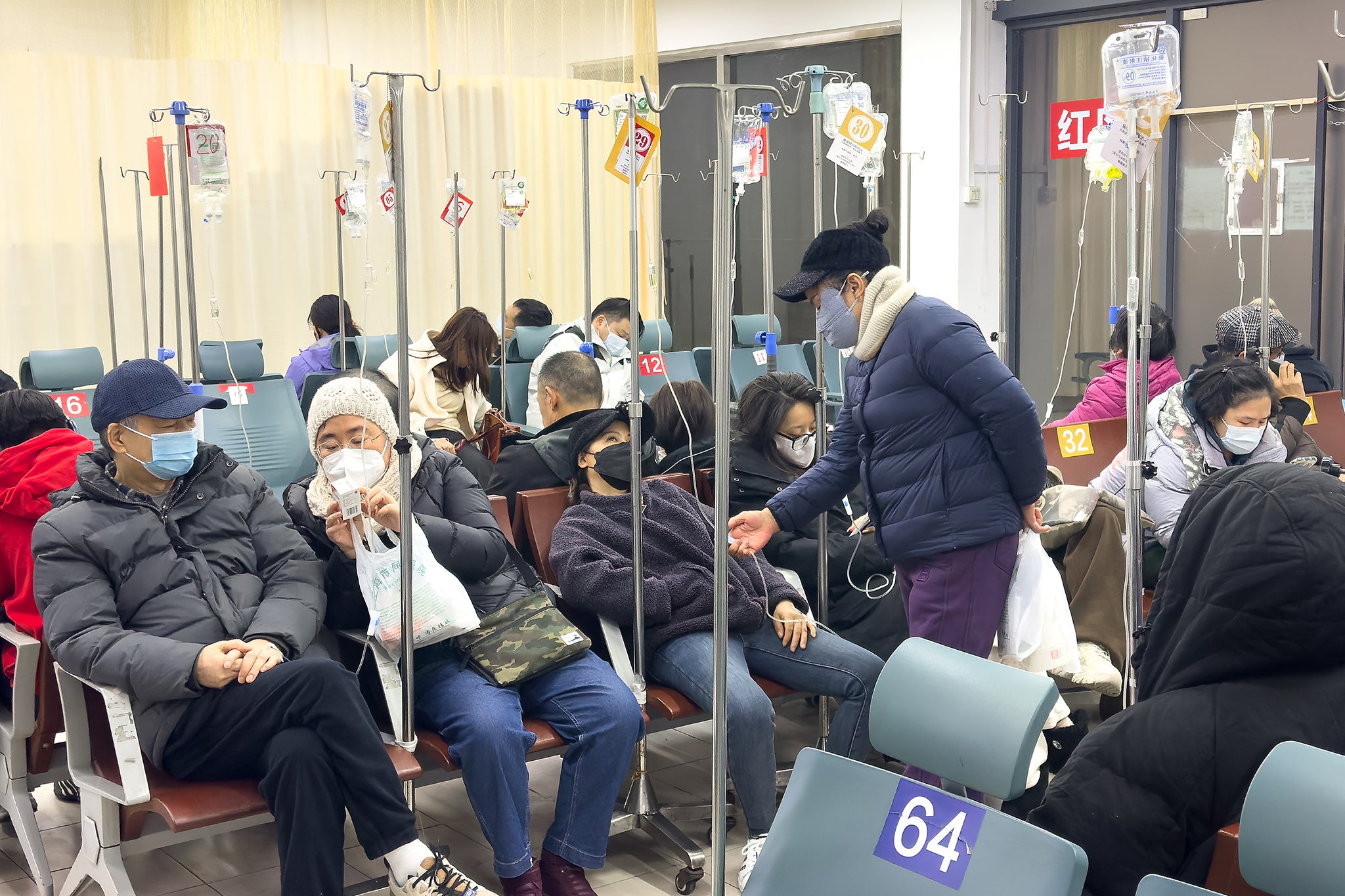 Patients receive infusion therapy at a hospital in Shanghai amid a spike in respiratory illnesses