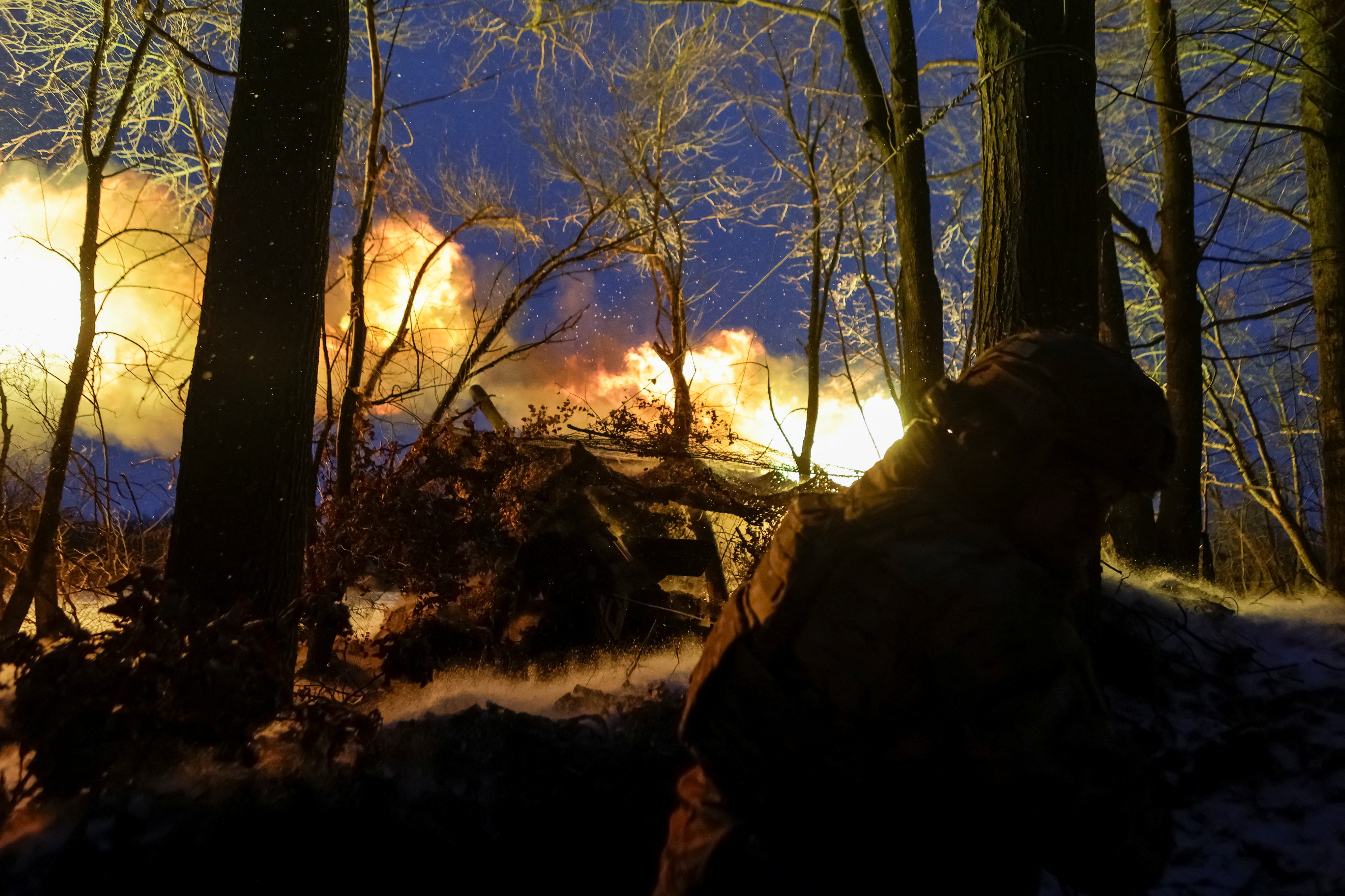 A serviceman of 13th Operative Purpose Brigade ‘Khartiia’ of the National Guard of Ukraine fires a Giatsint-B howitzer towards Russian troops at a position on a front line in Kharkiv region, Ukraine