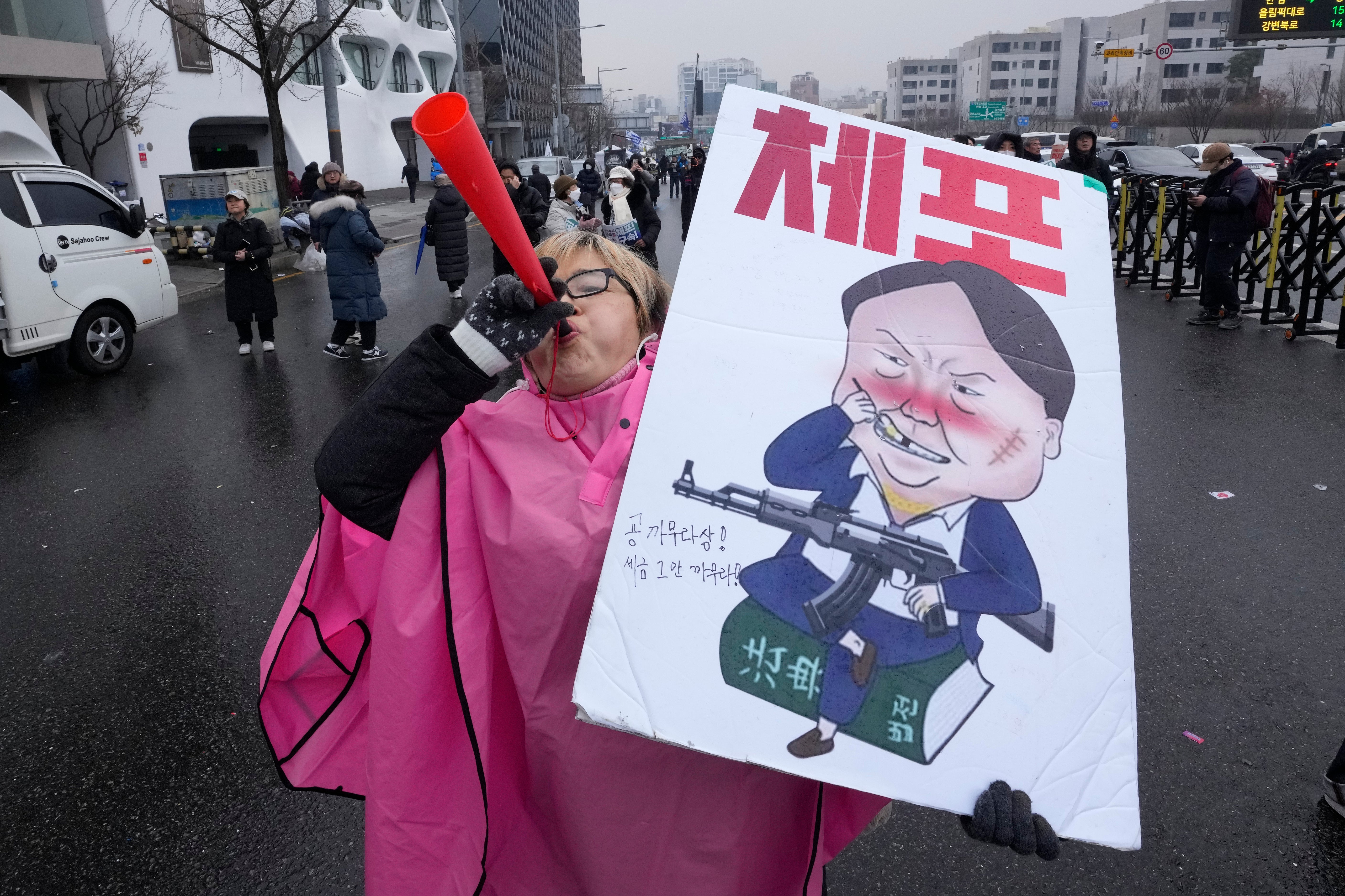 <p>A South Korean protester at a rally demanding Yoon Suk Yeol’s arrest near the presidential residence in Seoul</p>