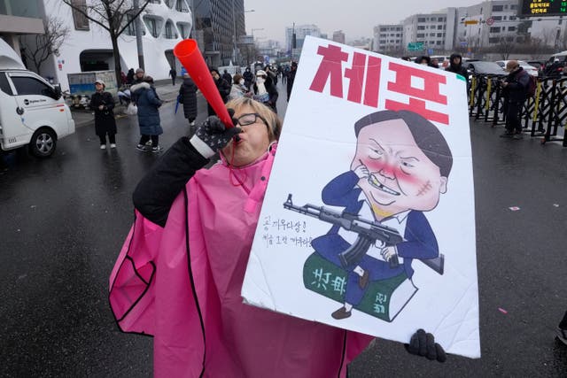<p>A South Korean protester at a rally demanding Yoon Suk Yeol’s arrest near the presidential residence in Seoul</p>