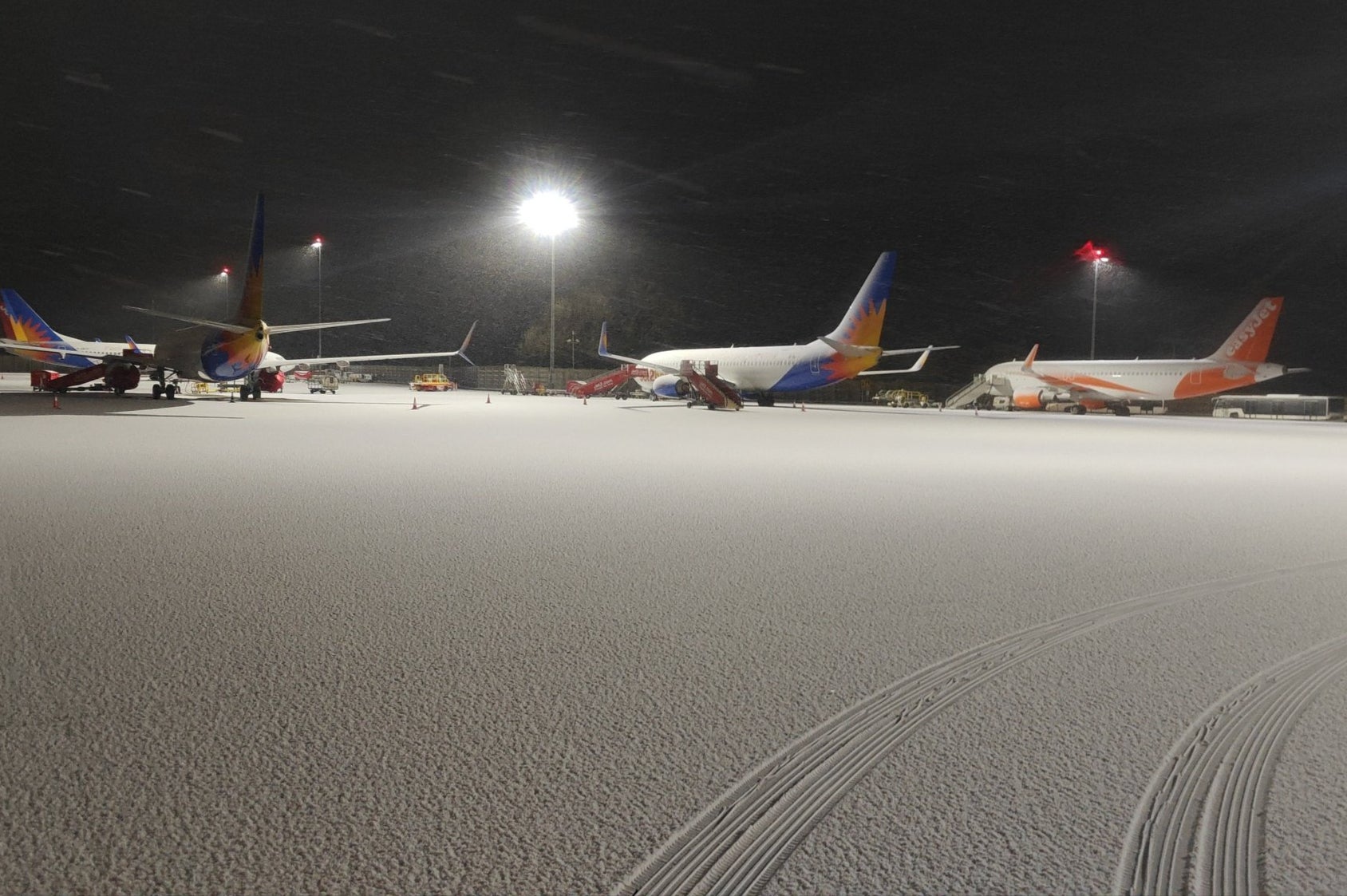 Snow and ice causes travel chaos for holidaymakers at major UK airports