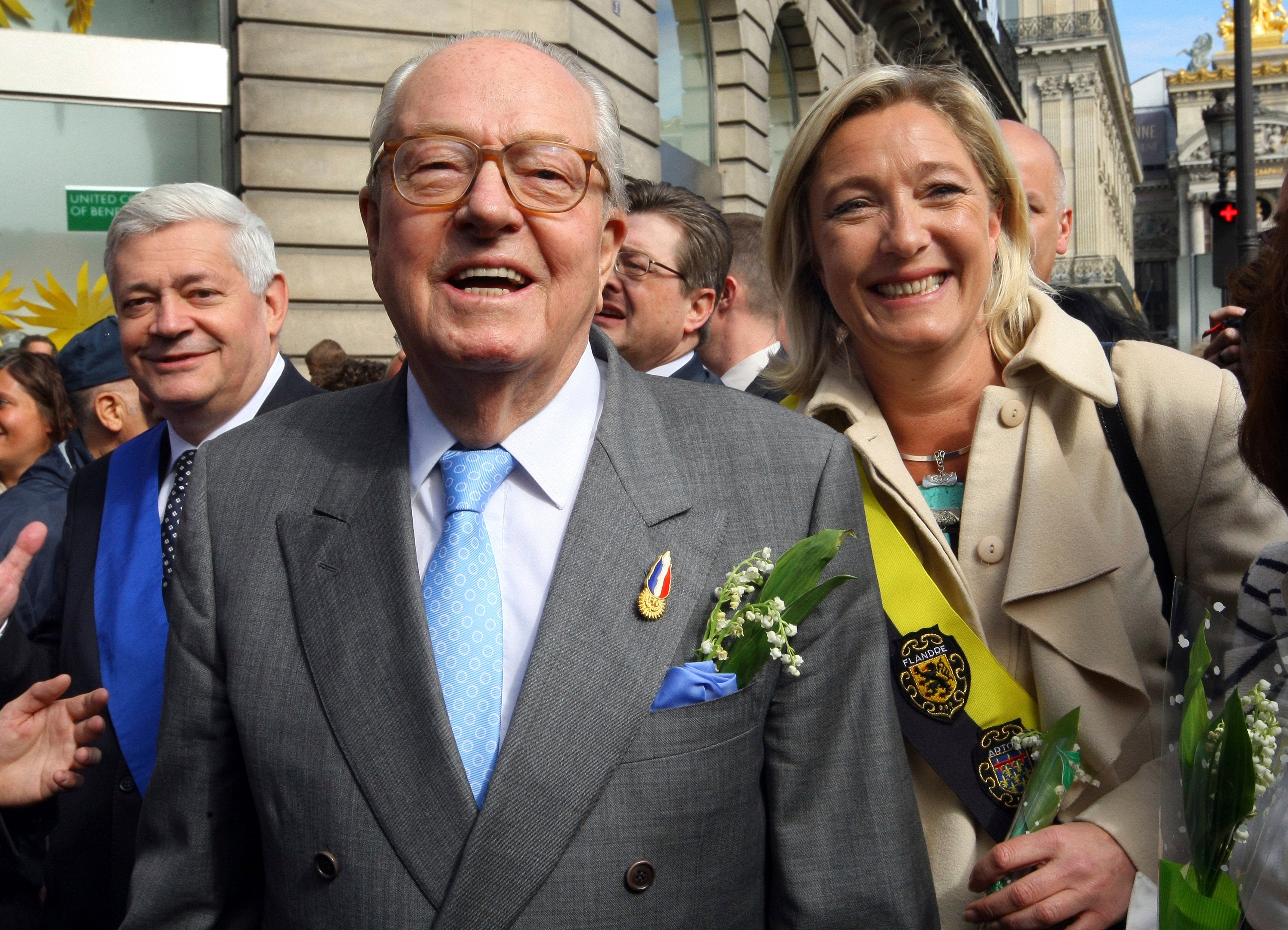 Jean-Marie Le Pen, centre, flanked by his daughter Marine, in 2010