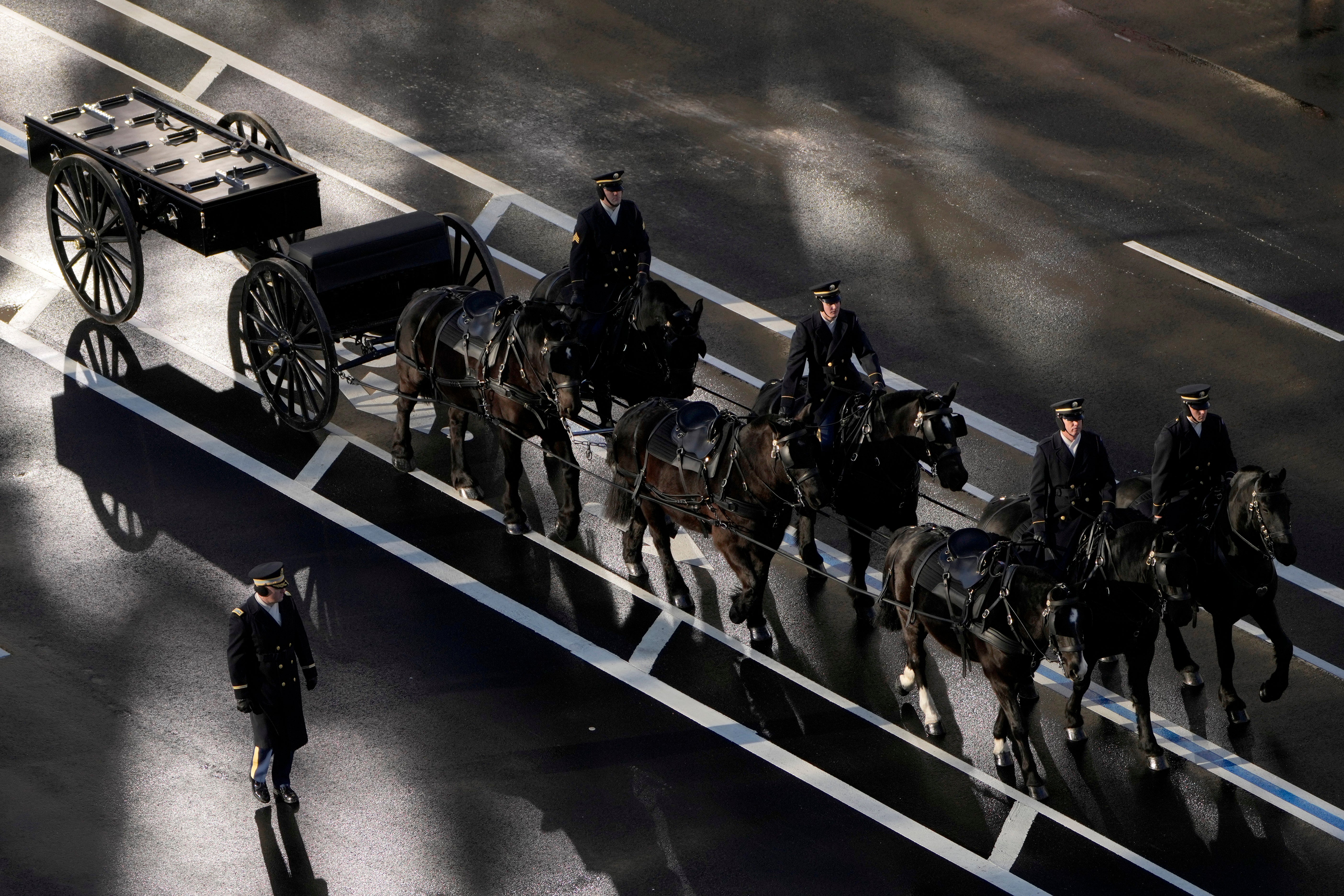 A horse-drawn caisson awaits the arrival of former President Jimmy Carter's casket at the U.S. Navy Memorial before traveling on to the Capitol on January 7, 2025 in Washington, DC