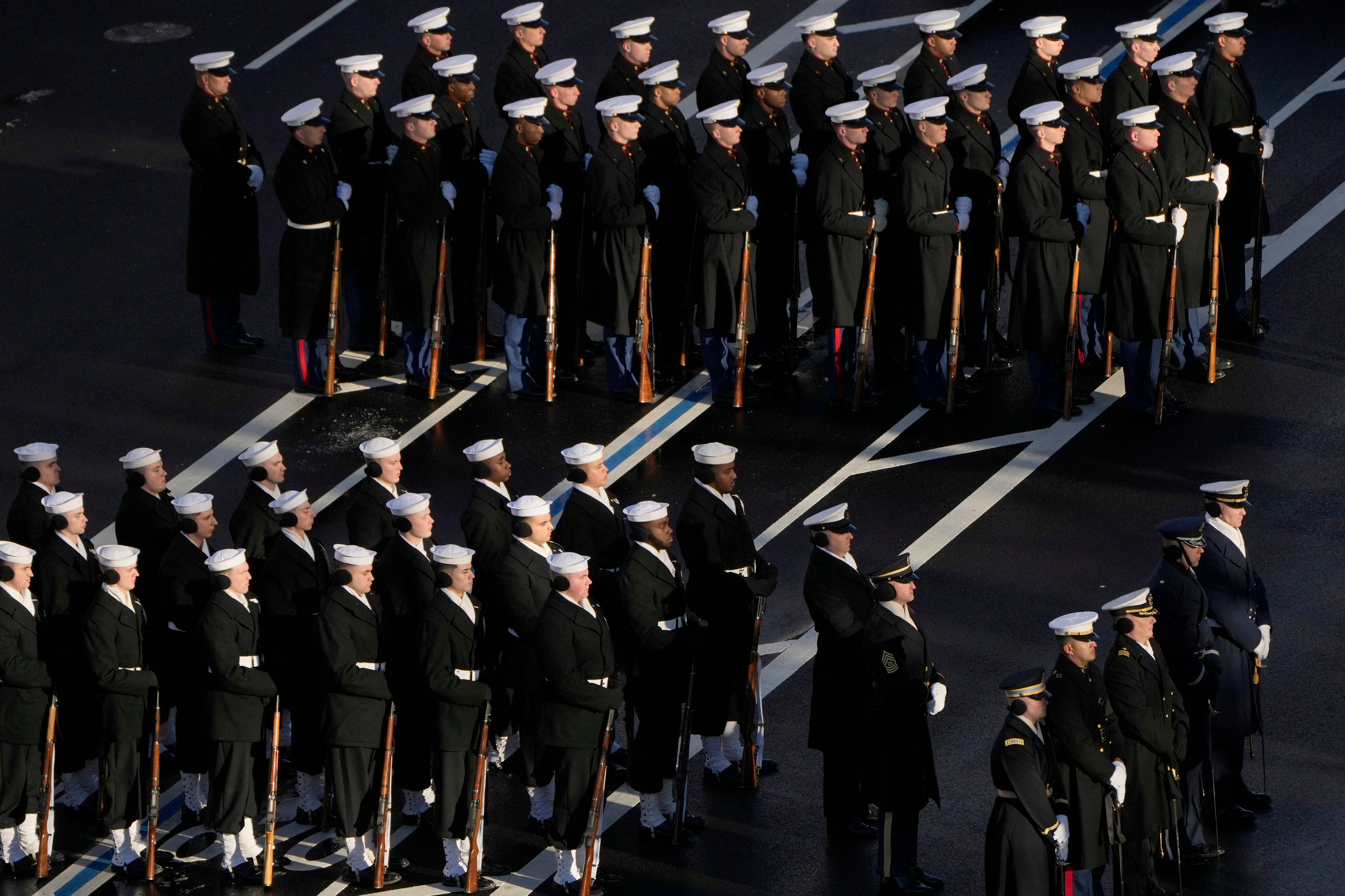 Members of the US Navy line up to march with with the casket of former US President Jimmy Carter, during Carter's State Funeral Procession from the US Navy Memorial to the US Capitol in Washington, DC on January 7, 2025