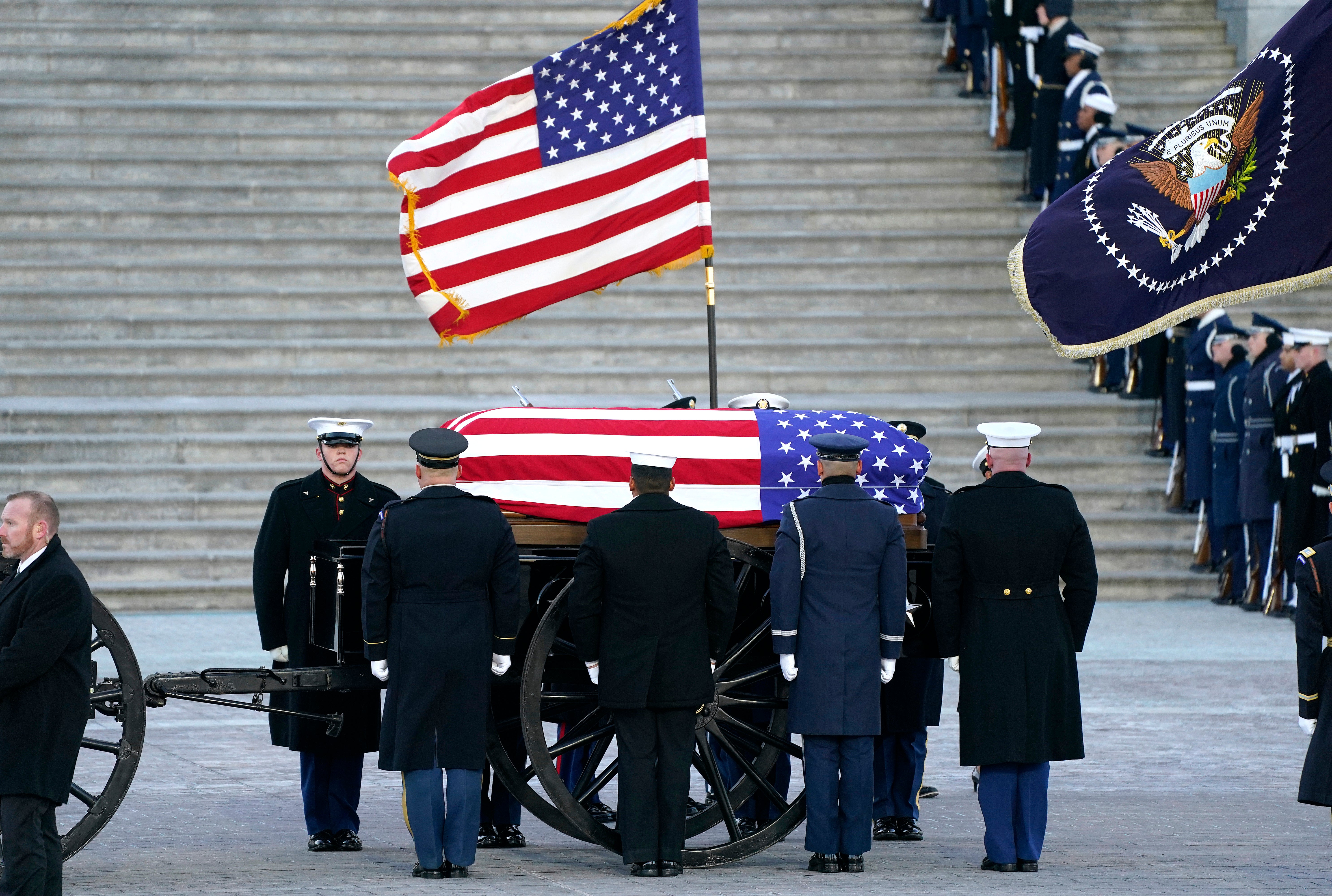 U.S. Military Body Bearers escort the casket bearing the remains of former U.S. President Jimmy Carter in a horse-drawn caisson as it arrives at the U.S. Capitol on January 07, 2025 in Washington, DC