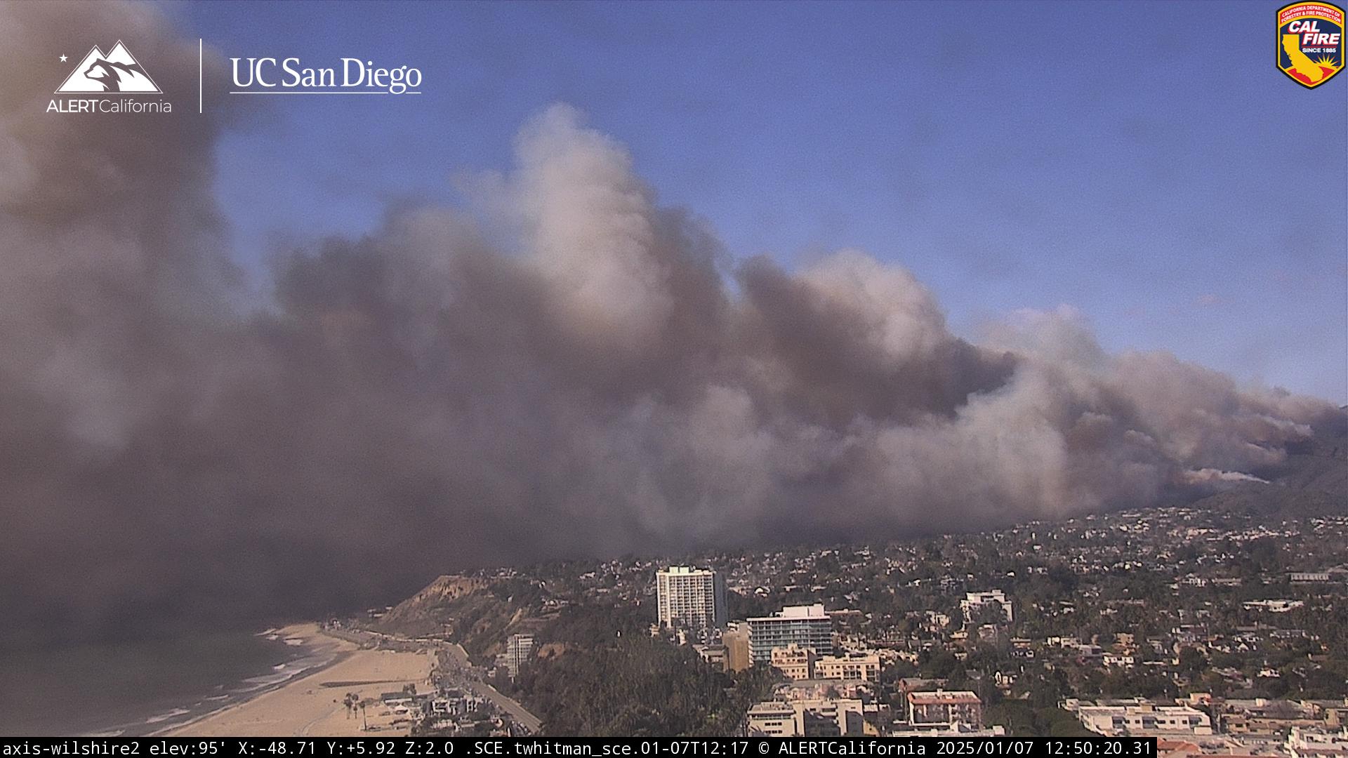 Smoke from the Palisades Fire fills otherwise blue skies. The region is seen another extreme wind event following December’s destructive Franklin Fire