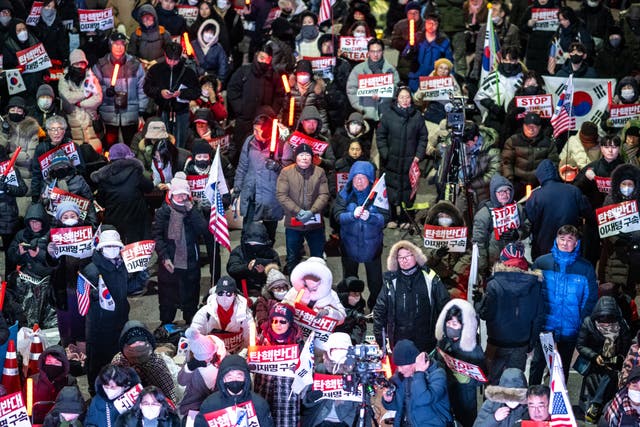 <p>Supporters of impeached South Korean president Yoon Suk Yeol take part in a rally near his residence in Seoul</p>