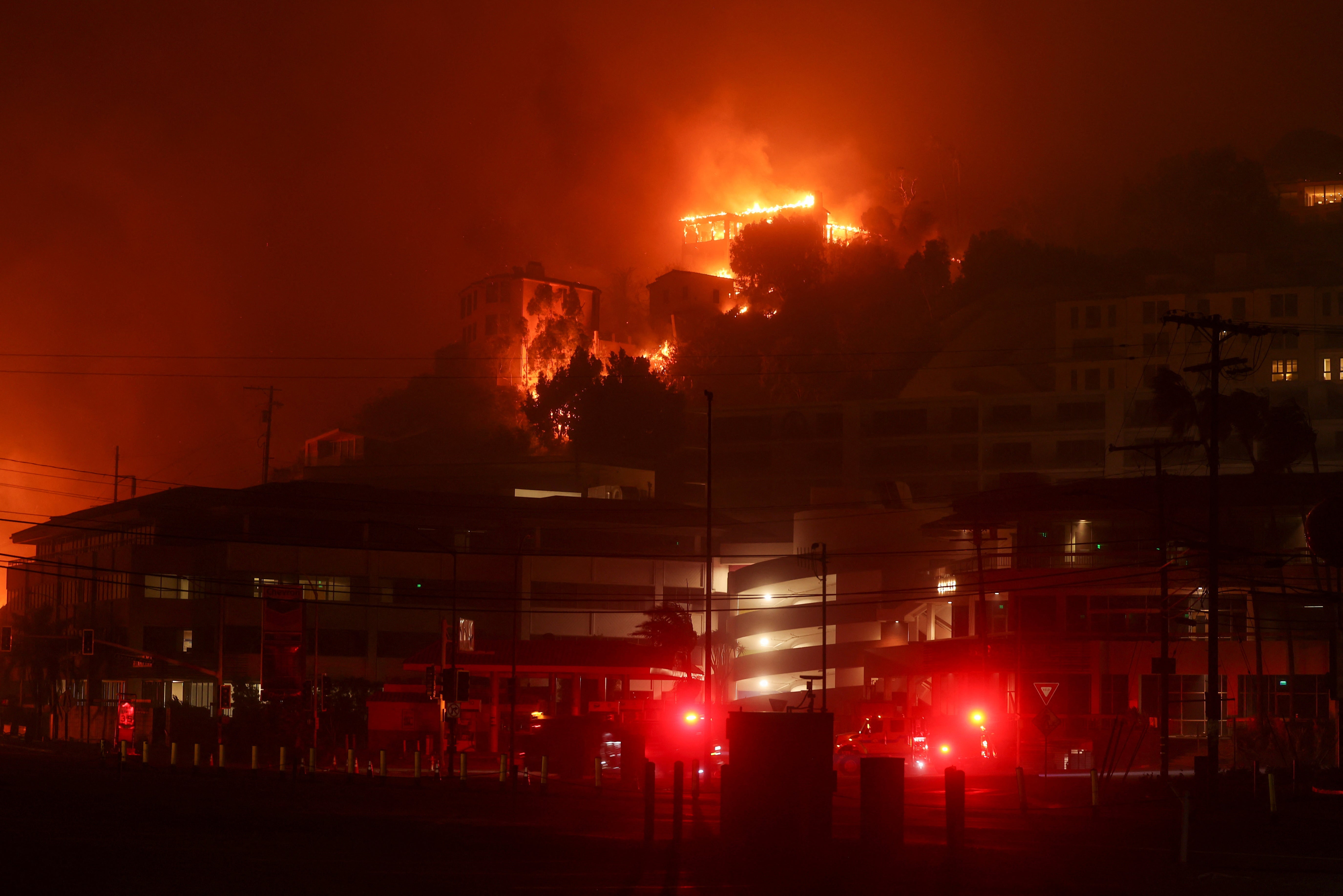 A building burns during the Palisades Fire in the Pacific Palisades neighborhood of west Los Angeles, California, 7 January 2025