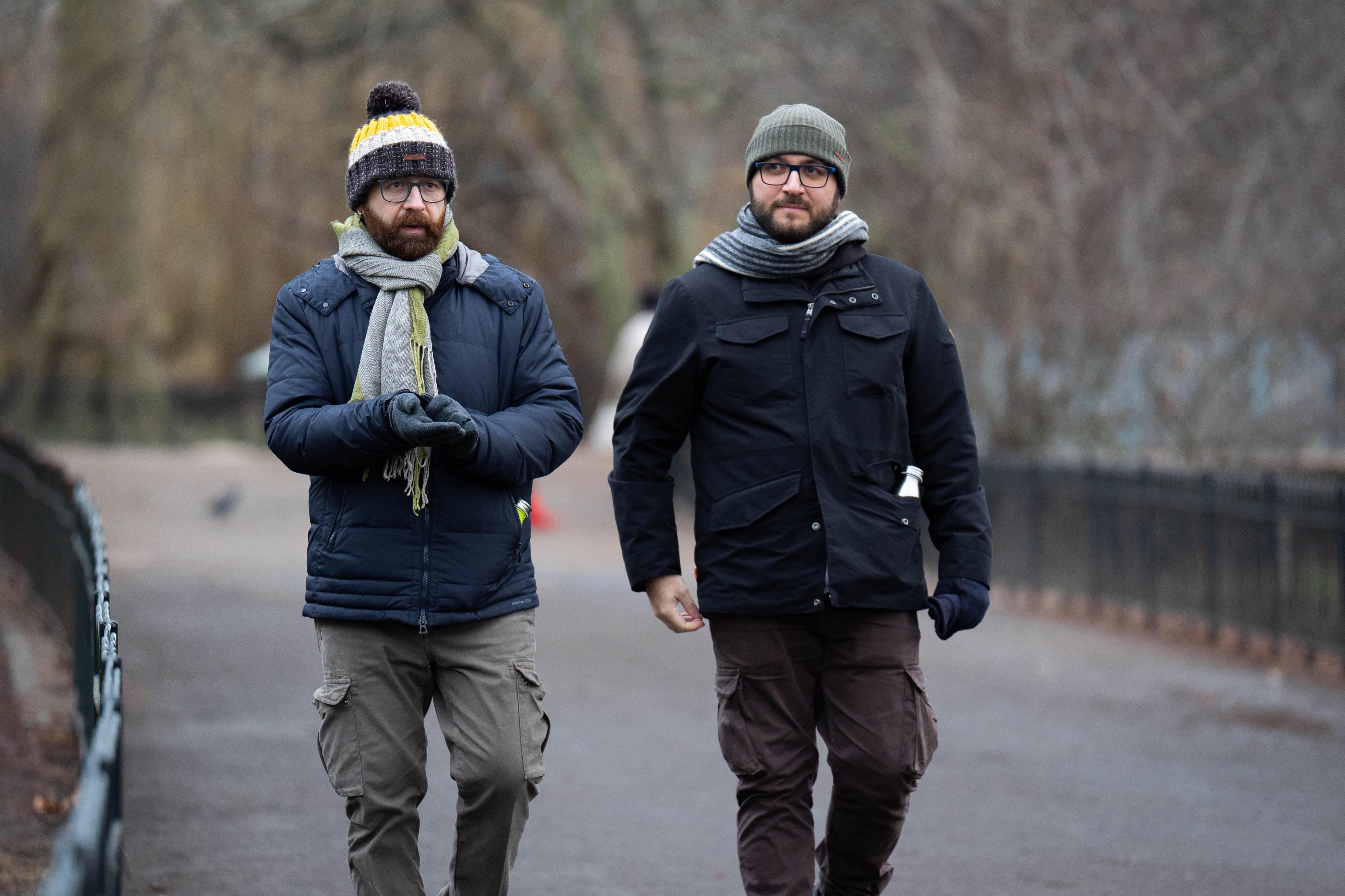 People walk through St James’ Park, central London, as Londoners prepare for possible snowfall on Wednesday