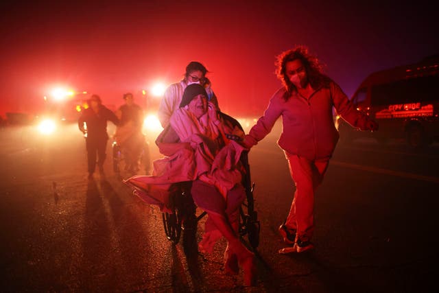 <p>Residents of a senior center are evacuated as the Eaton Fire approaches Tuesday, Jan. 7, 2025, in Altadena, California </p>