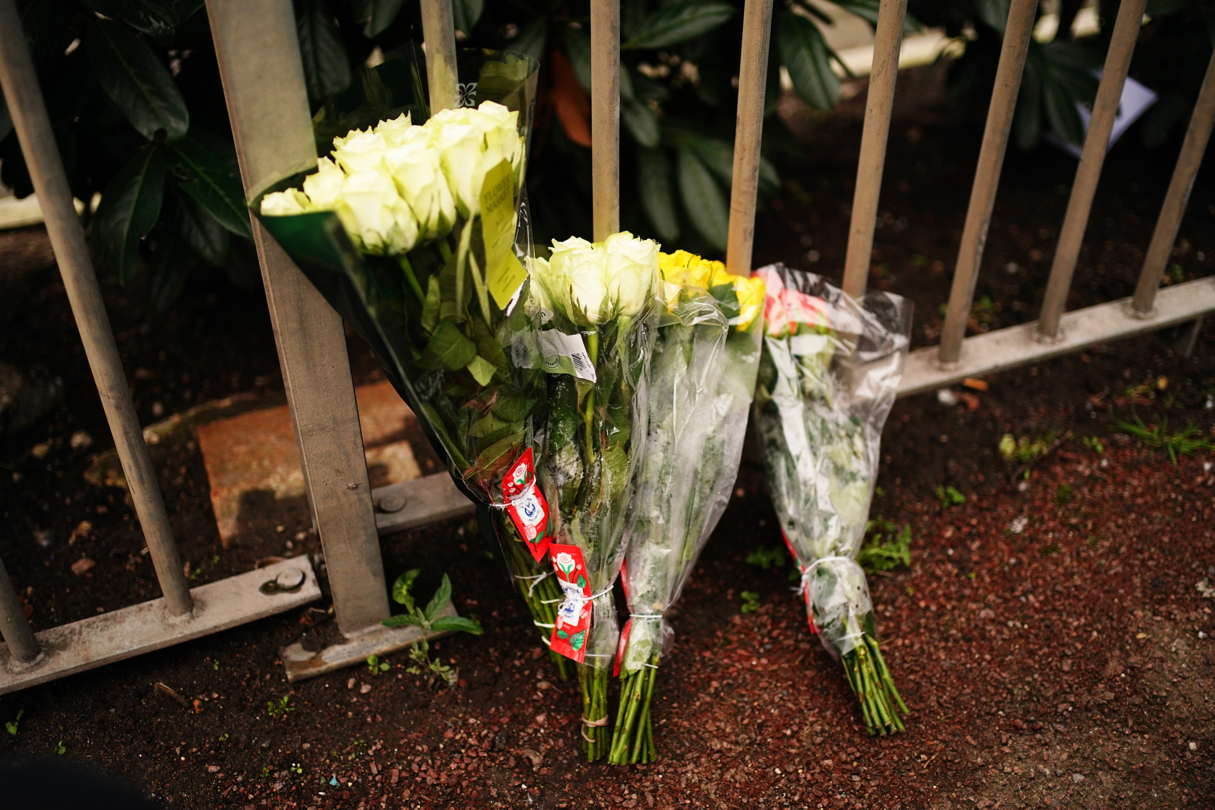 Flowers left in tribute at a bus stop in south-east London