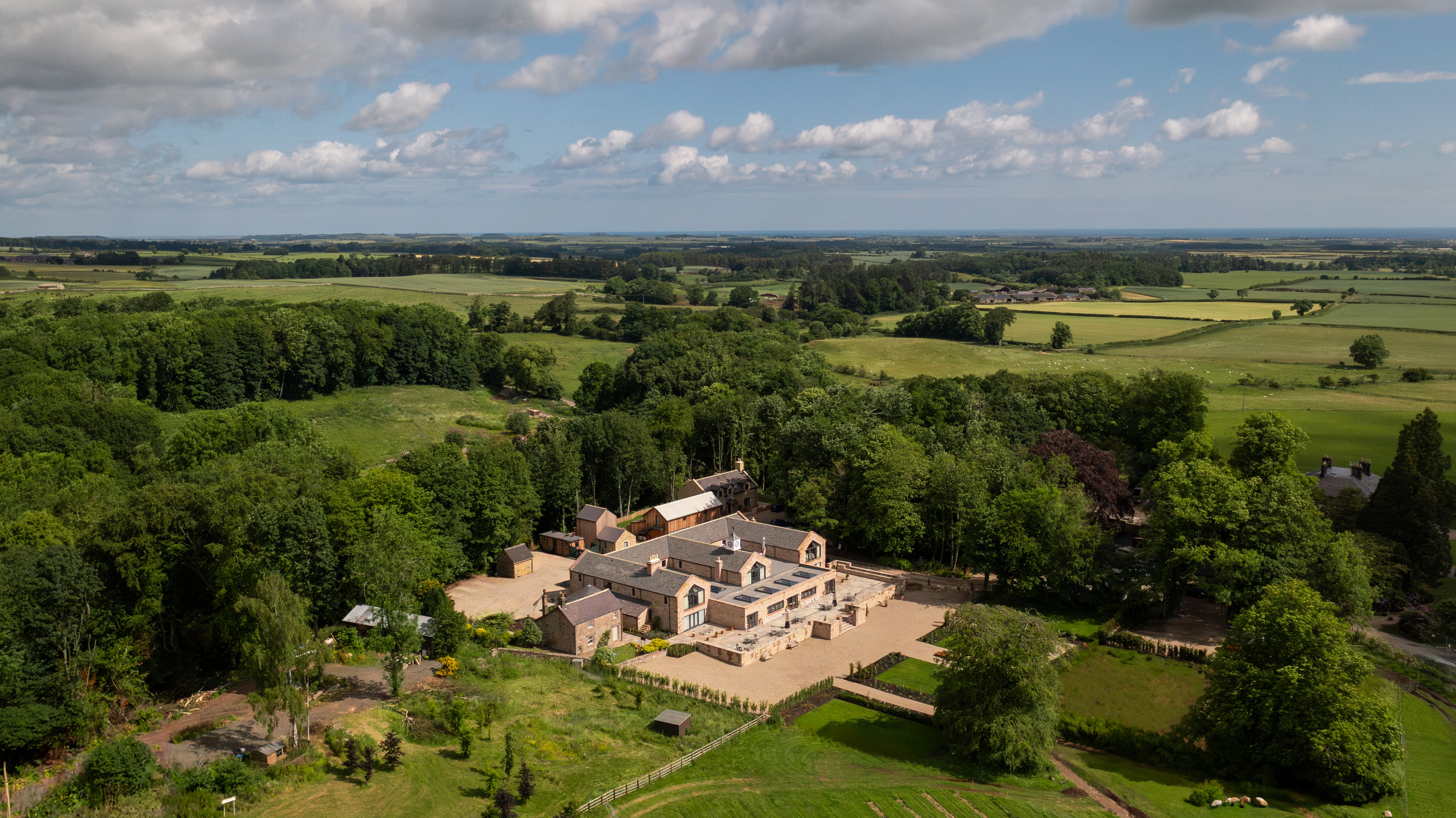 The Tempus Hotel is spread out across several buildings, including a main house, barns and lodges